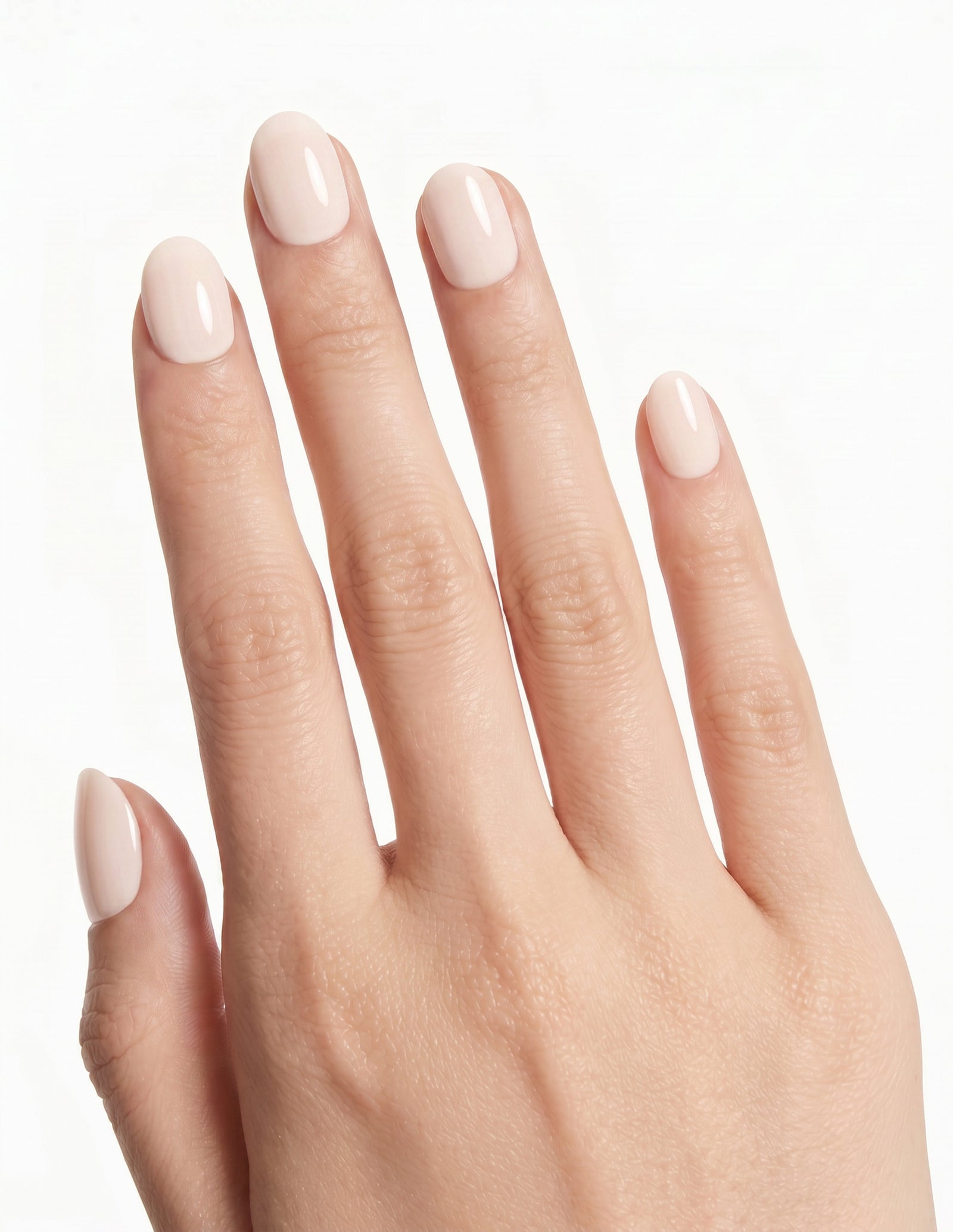 Cream Crème press-on nails — Oval (extra-short), light-skin hand, back of hand