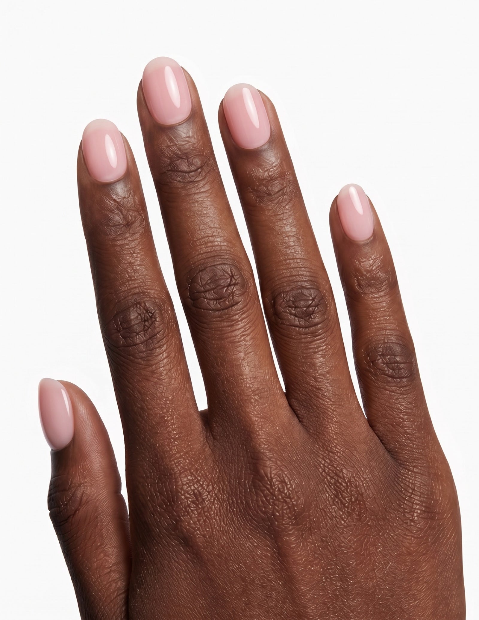 Ballet Slipper press-on nails — Oval (extra-short), deep-skin hand, back of hand