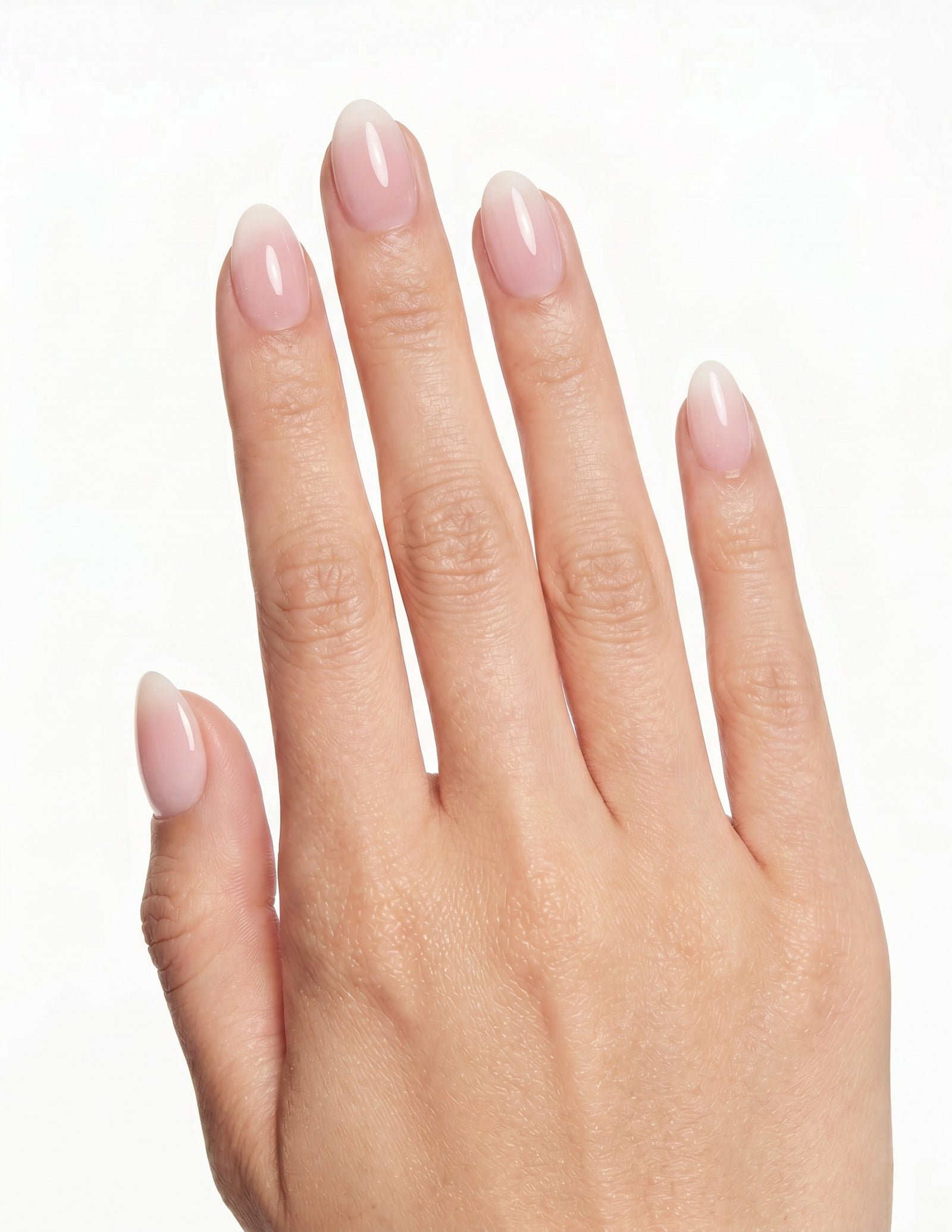 Milk Bath press-on nails — Almond (extra-short), light-skin hand, back of hand
