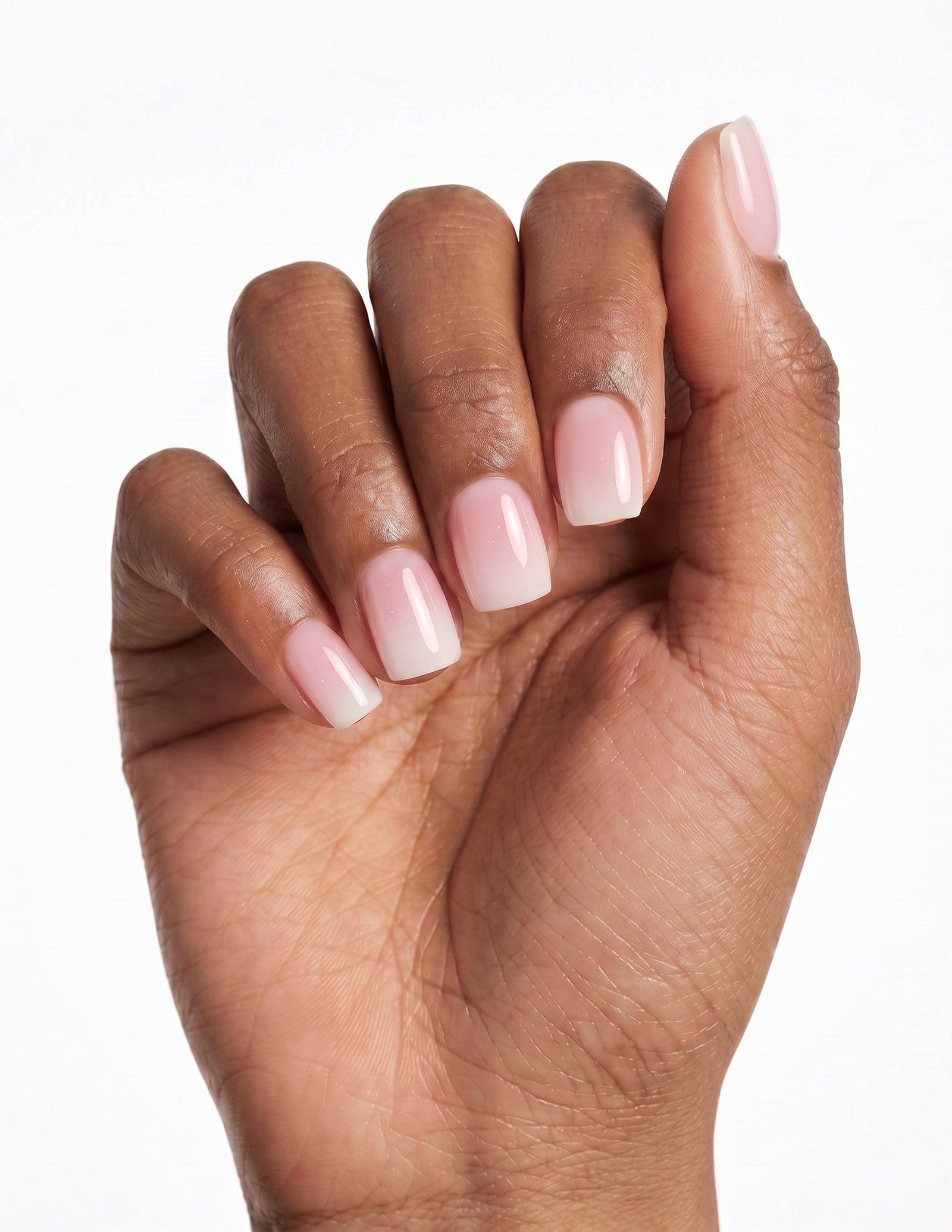 Milk Bath press-on nails — Coffin (short), deep-skin hand, back of hand