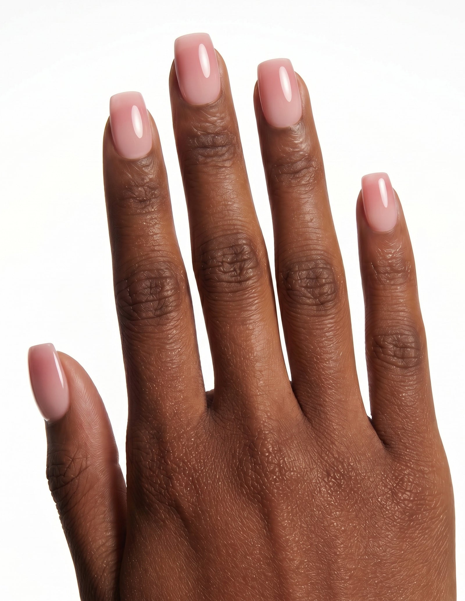 First Blush press-on nails — Coffin (short), deep-skin hand, back of hand