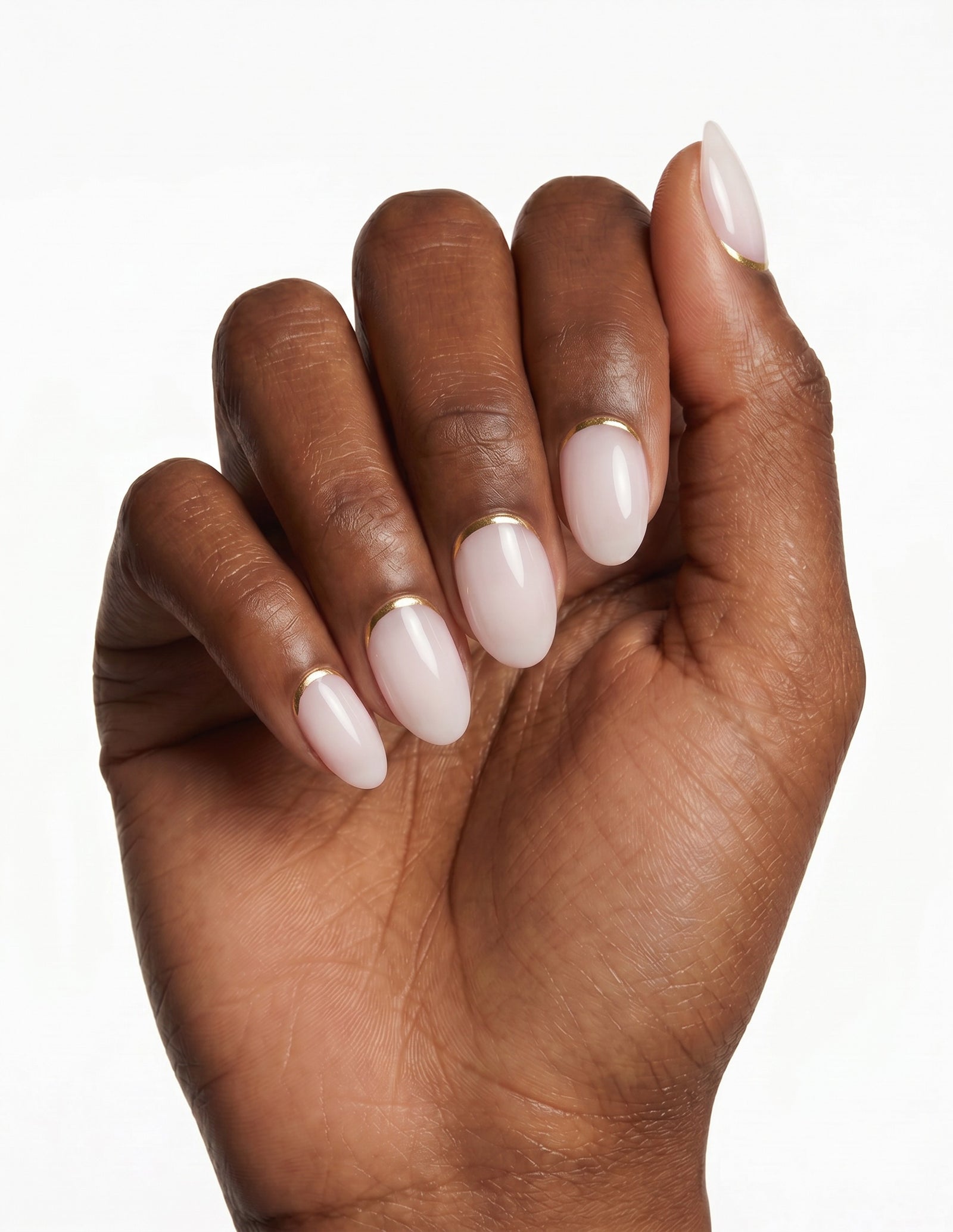 Gold Leaf press-on nails — Almond (extra-short), deep-skin hand, fingers curled