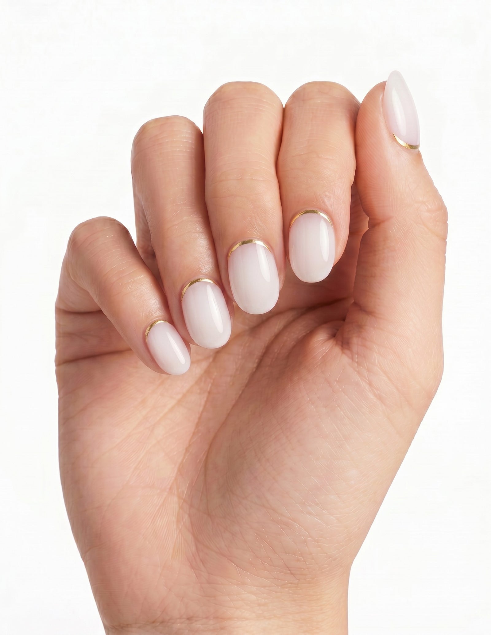 Gold Leaf press-on nails — Oval (extra-short), light-skin hand, back of hand