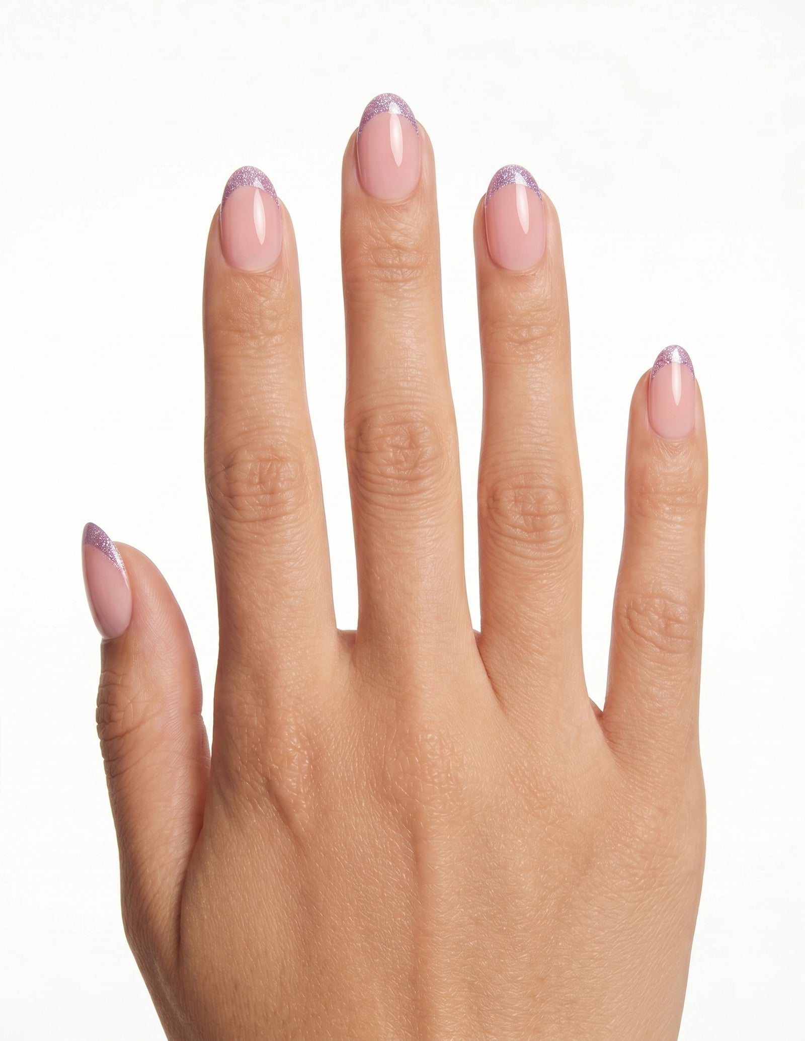 Opal Tips press-on nails — Almond (extra-short), tan hand, back of hand