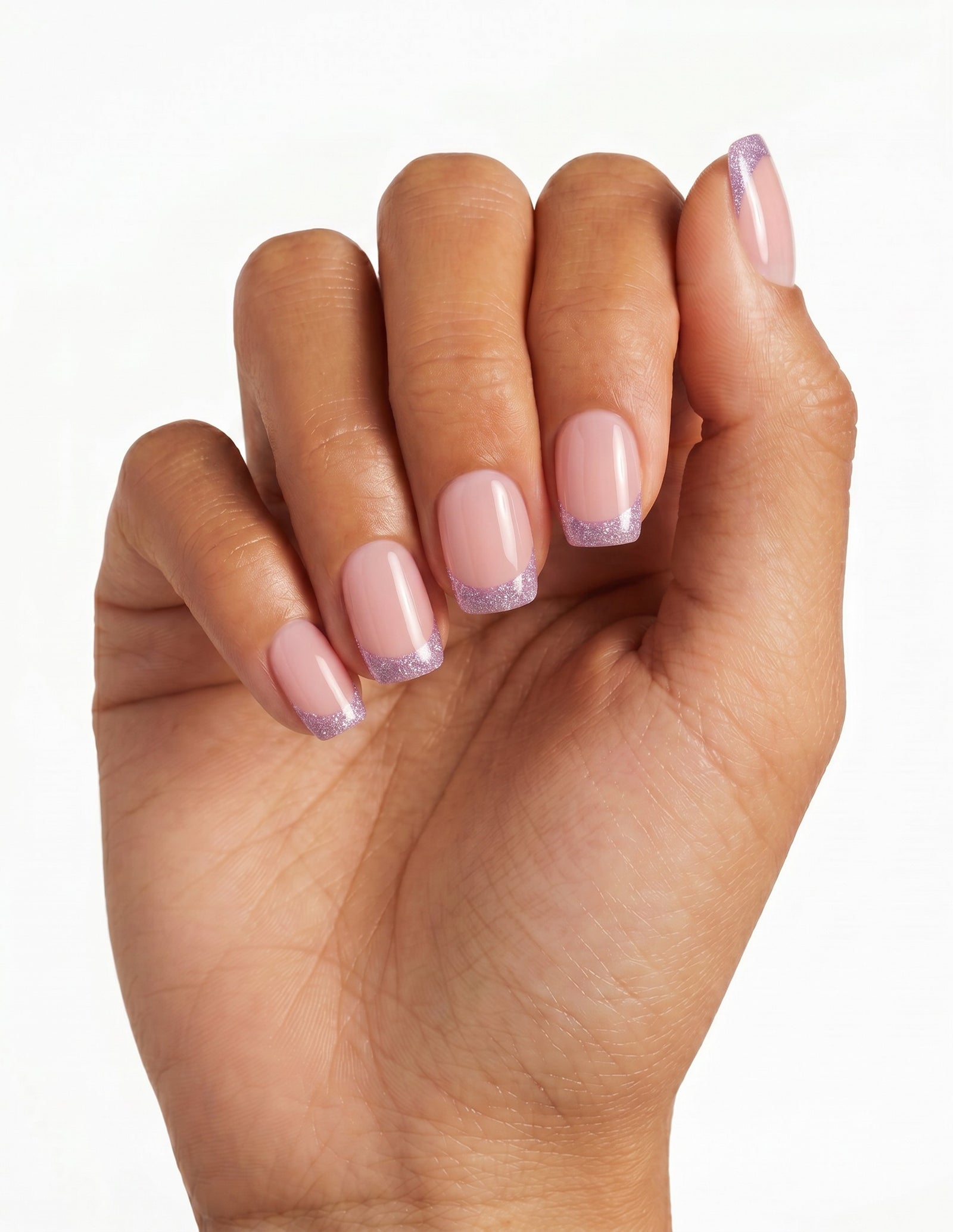 Opal Tips press-on nails — Coffin (short), tan hand, fingers curled