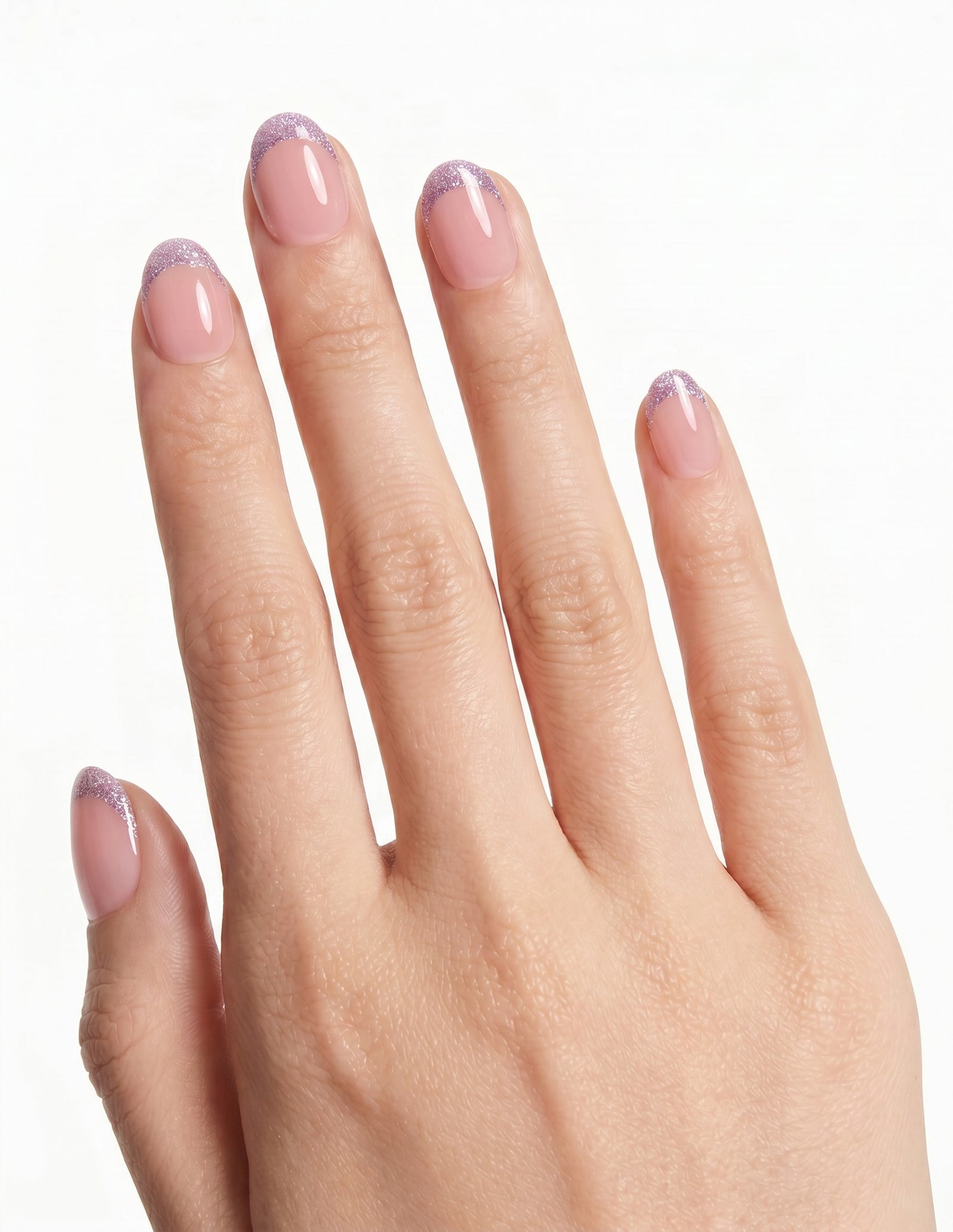 Opal Tips press-on nails — Oval (extra-short), light-skin hand, back of hand