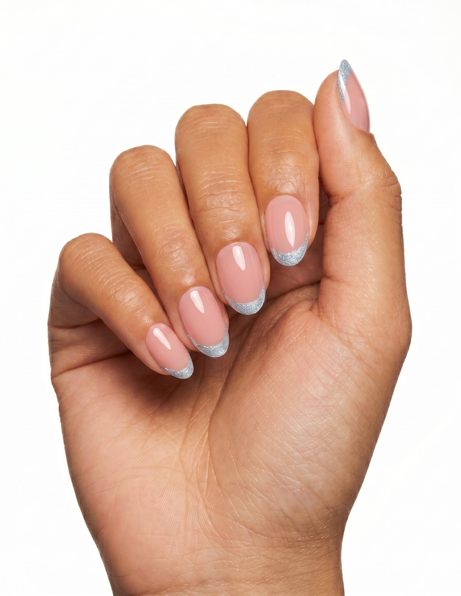 Something Blue press-on nails — Almond (extra-short), tan hand, fingers curled