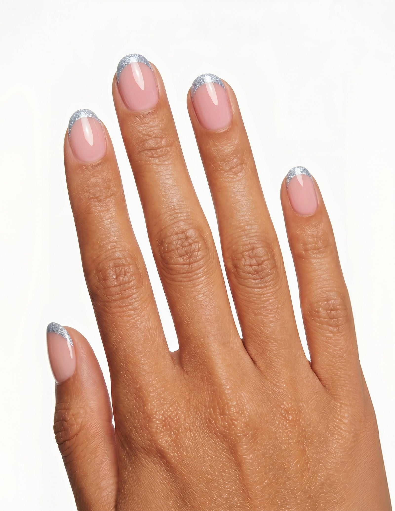 Something Blue press-on nails — Oval (extra-short), tan hand, back of hand
