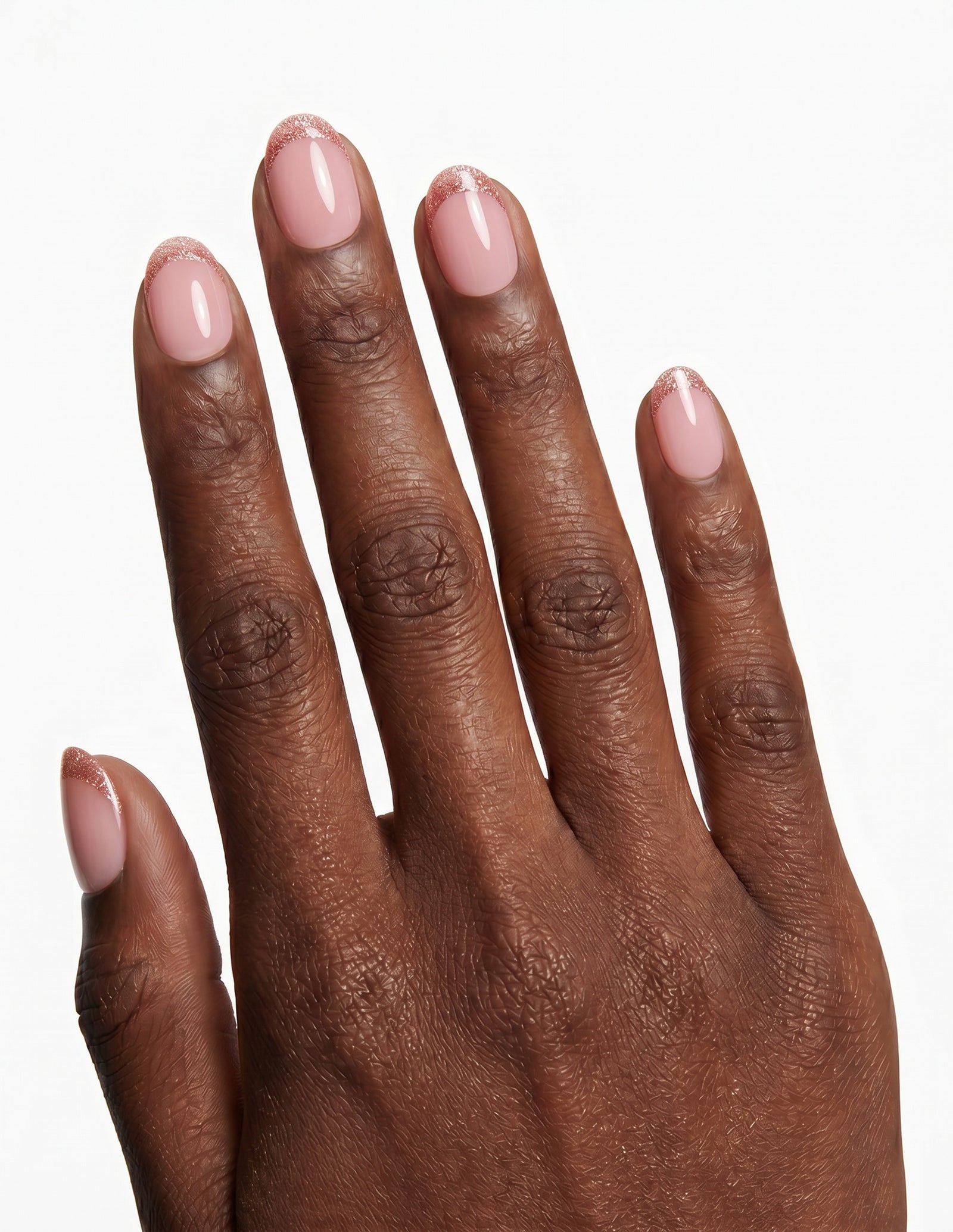 Pearl Tips press-on nails — Oval (extra-short), deep-skin hand, back of hand