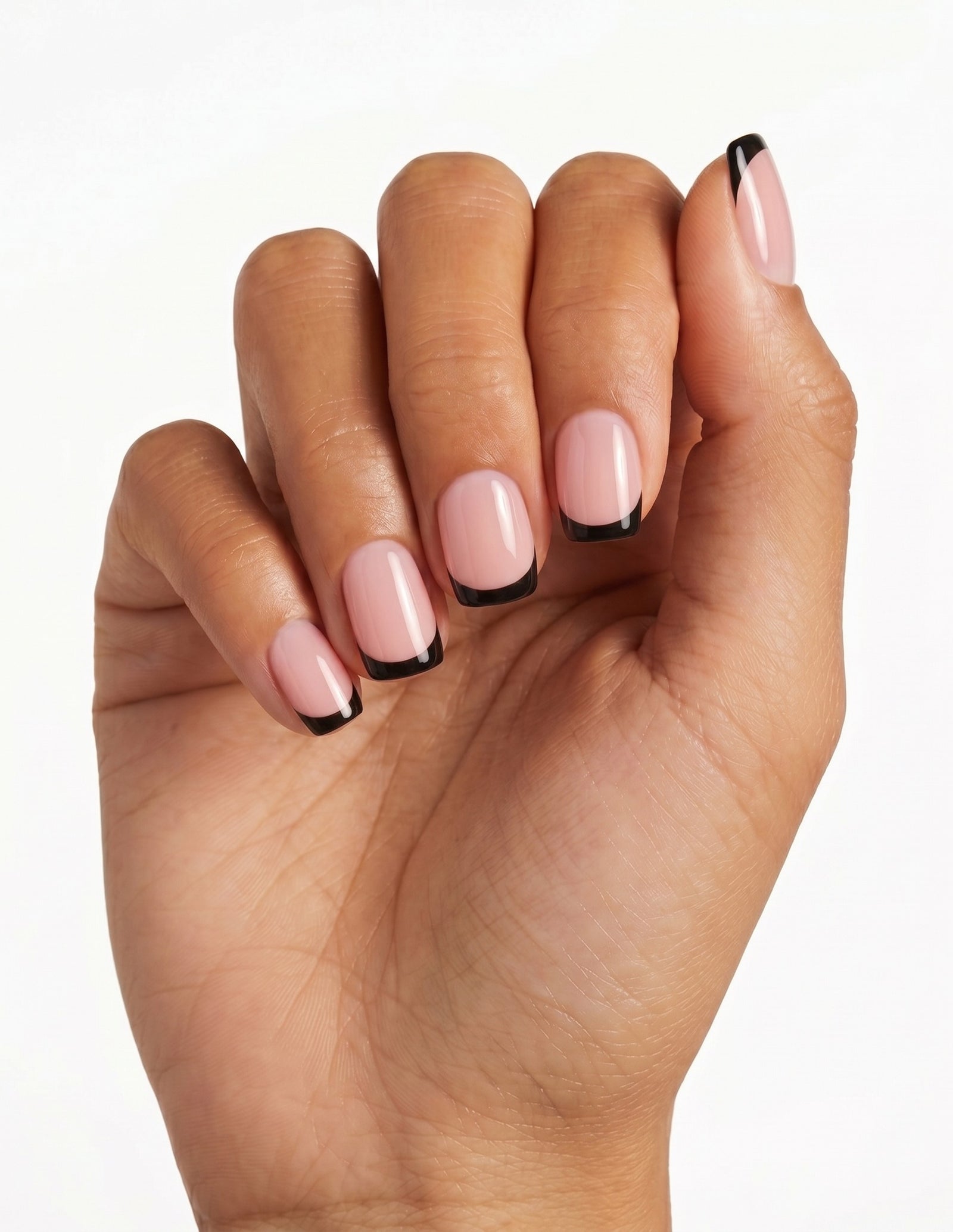 After Hours press-on nails — Coffin (short), tan hand, fingers curled
