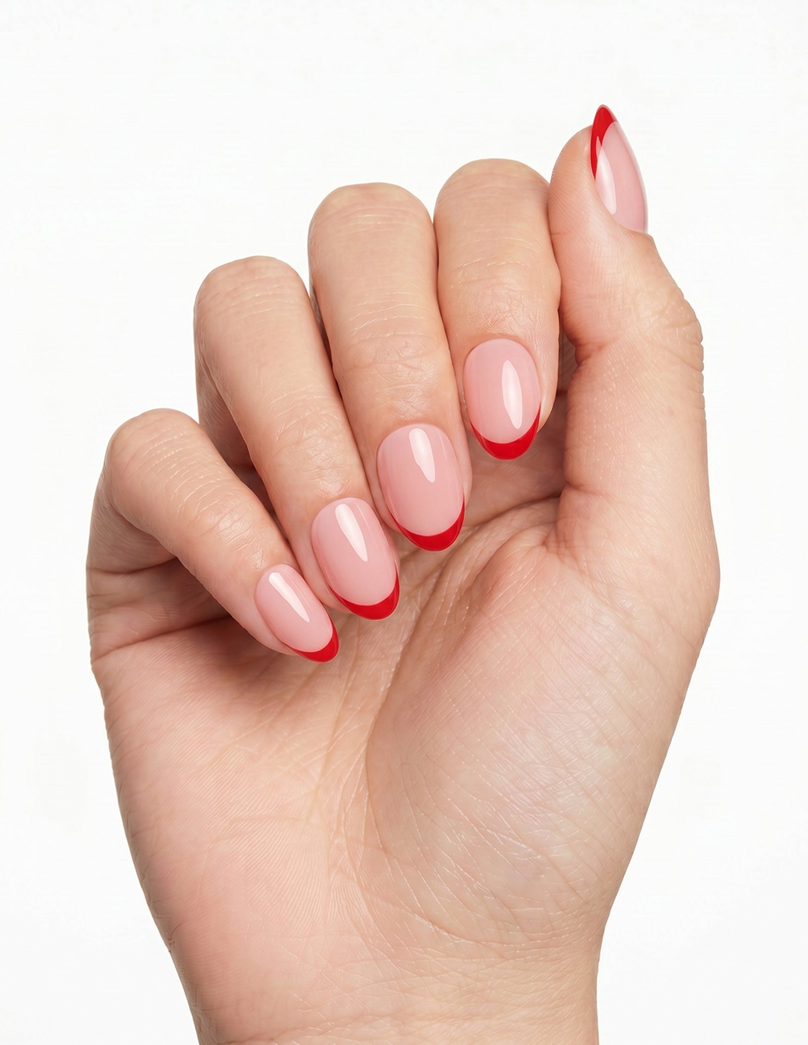 Rouge Tips press-on nails — Almond (extra-short), light-skin hand, fingers curled