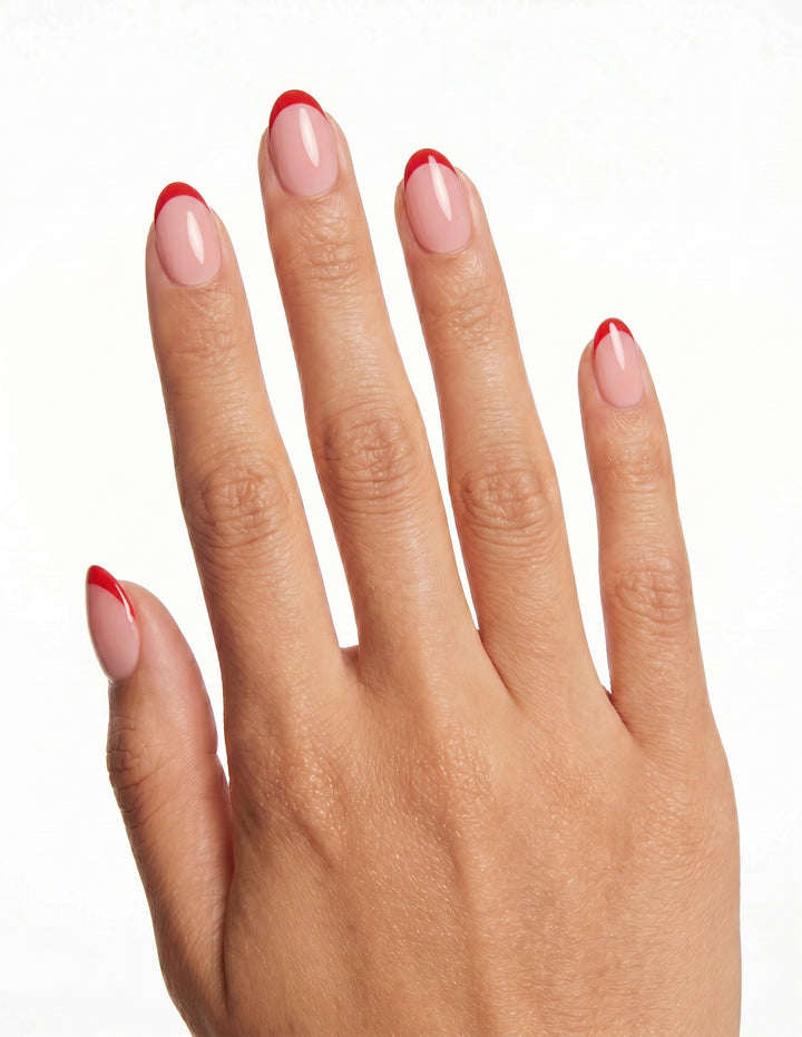 Rouge Tips press-on nails — Almond (extra-short), tan hand, back of hand