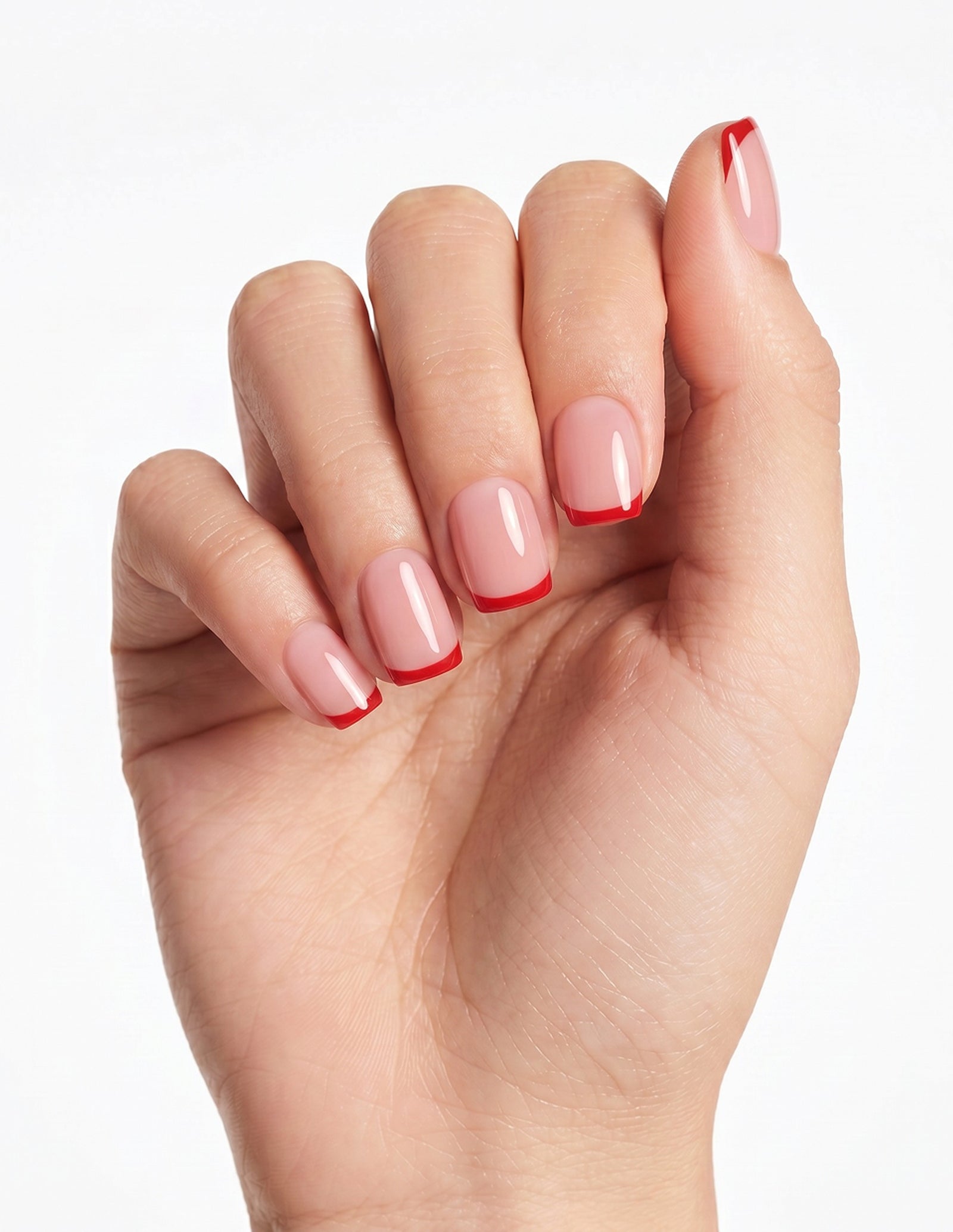 Rouge Tips press-on nails — Coffin (short), light-skin hand, fingers curled