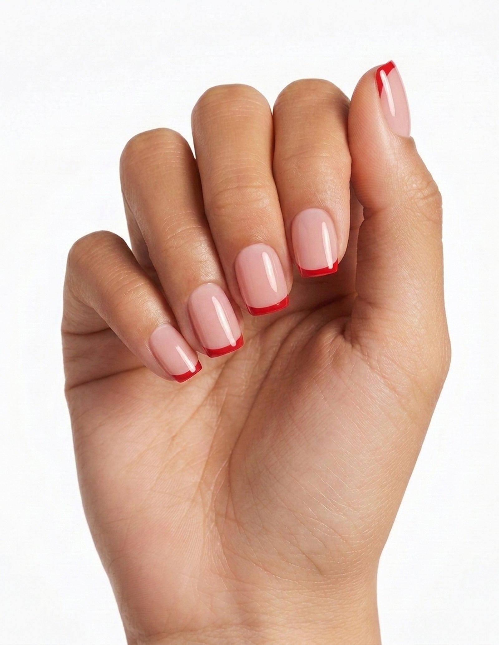 Rouge Tips press-on nails — Coffin (short), tan hand, fingers curled