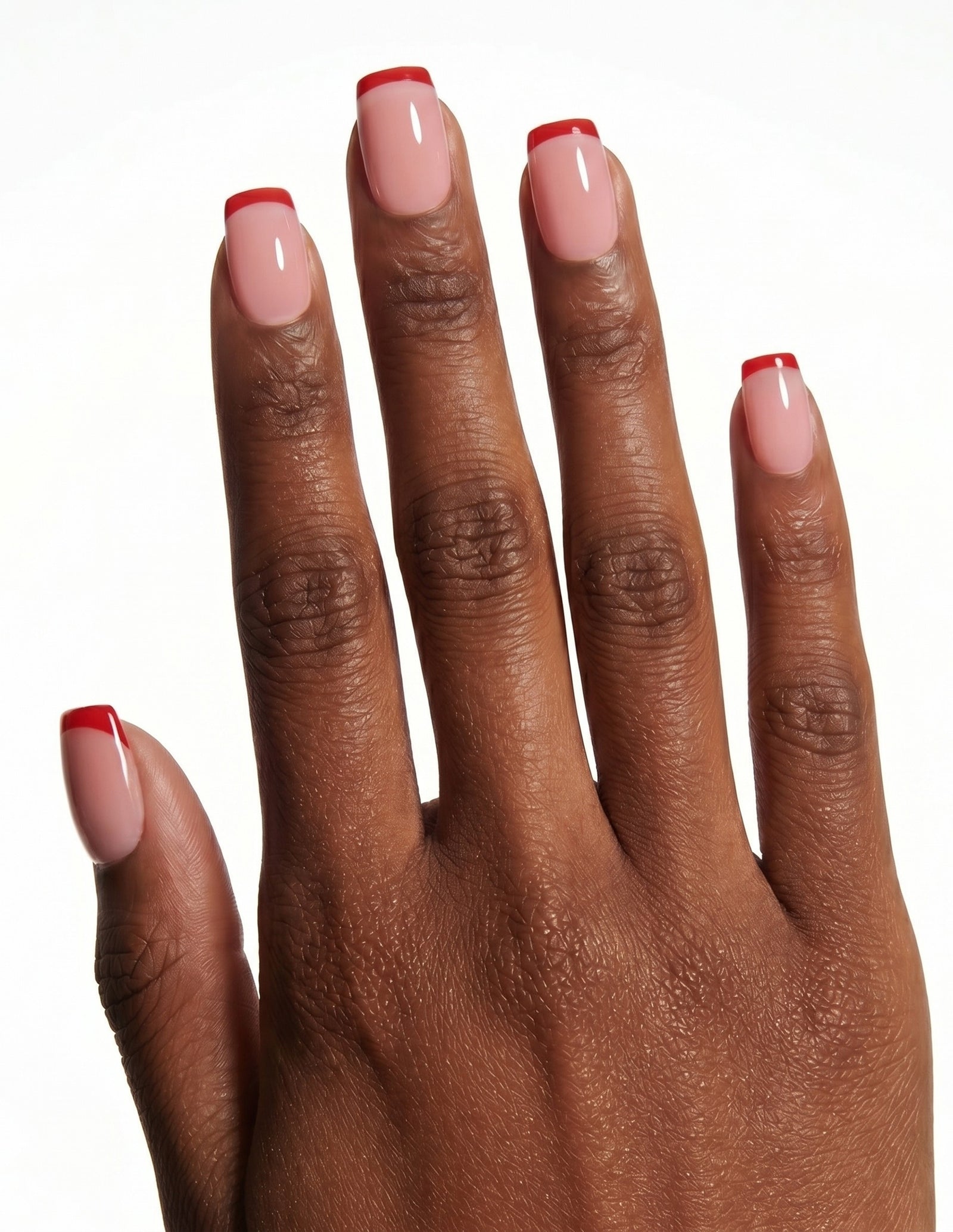 Rouge Tips press-on nails — Coffin (short), deep-skin hand, back of hand