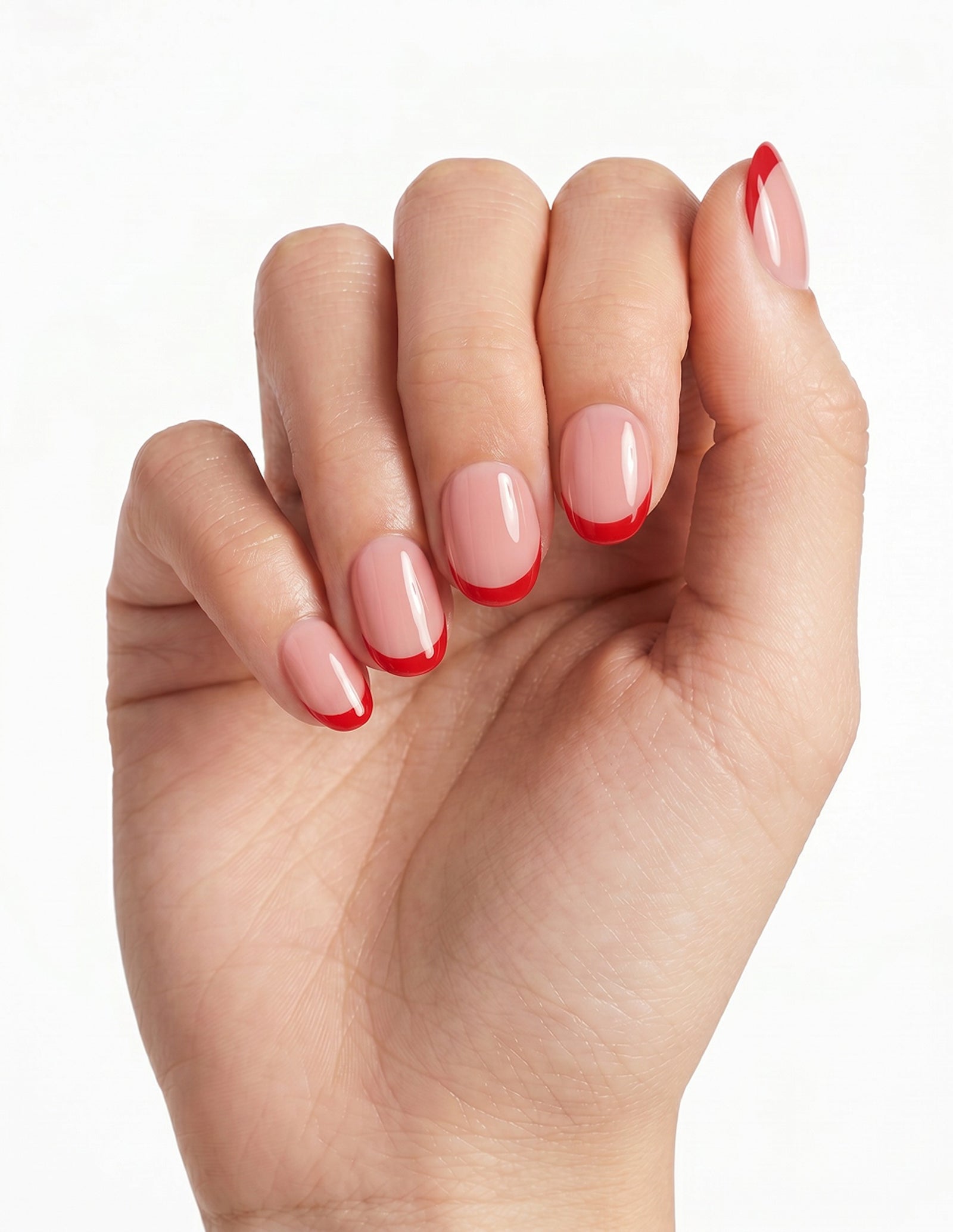 Rouge Tips press-on nails — Oval (extra-short), light-skin hand, fingers curled