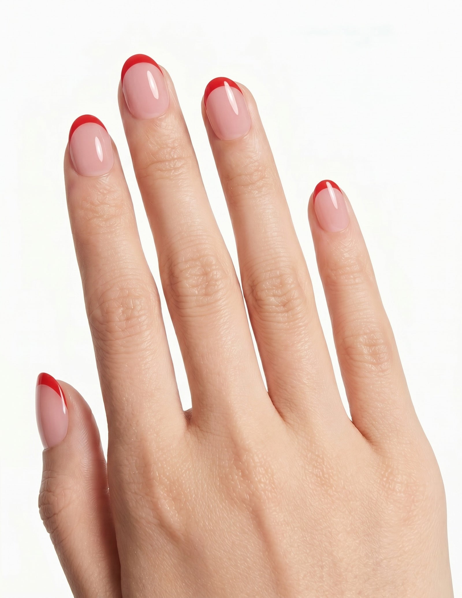 Rouge Tips press-on nails — Oval (extra-short), light-skin hand, back of hand
