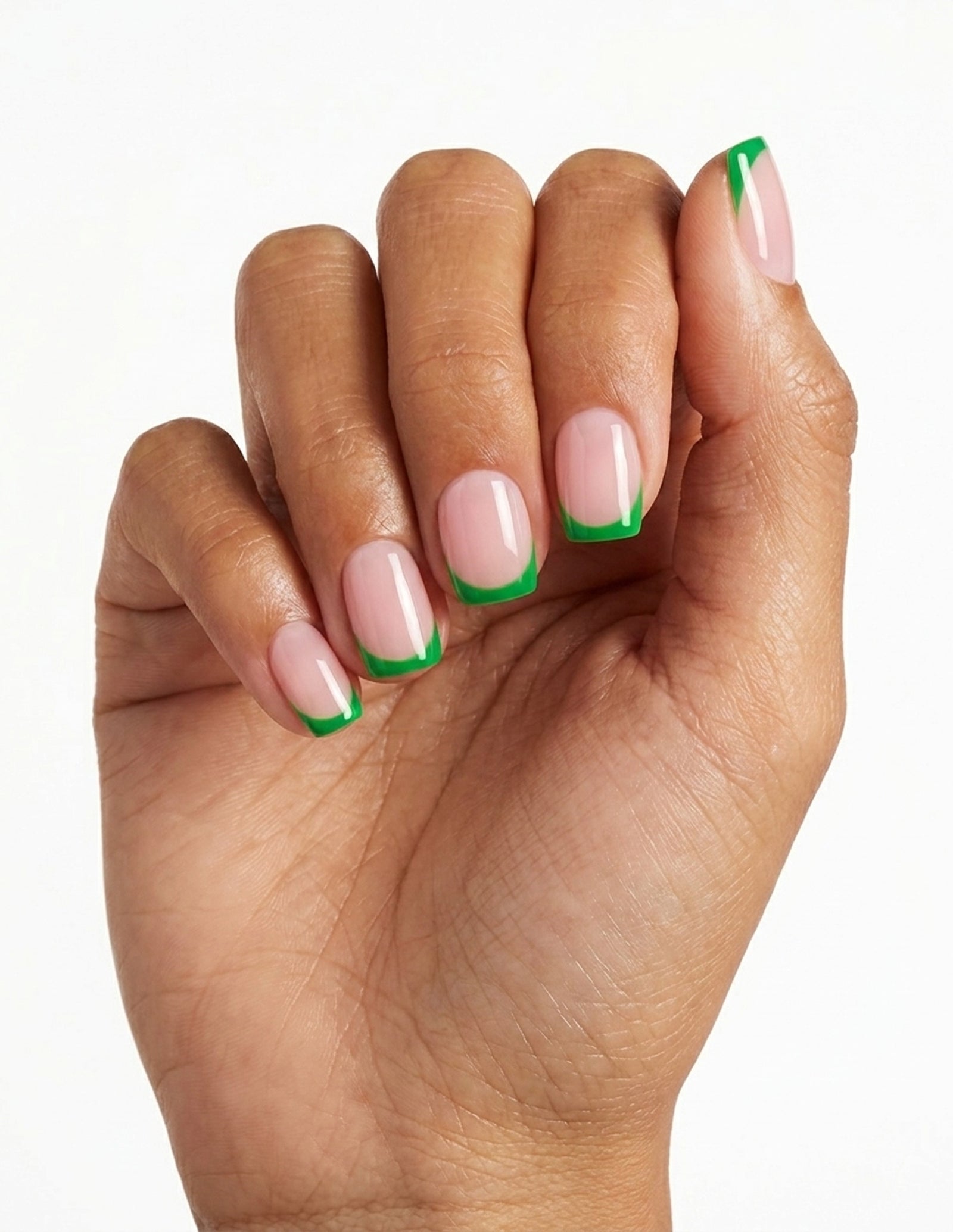 Lime Tips press-on nails — Coffin (short), tan hand, fingers curled