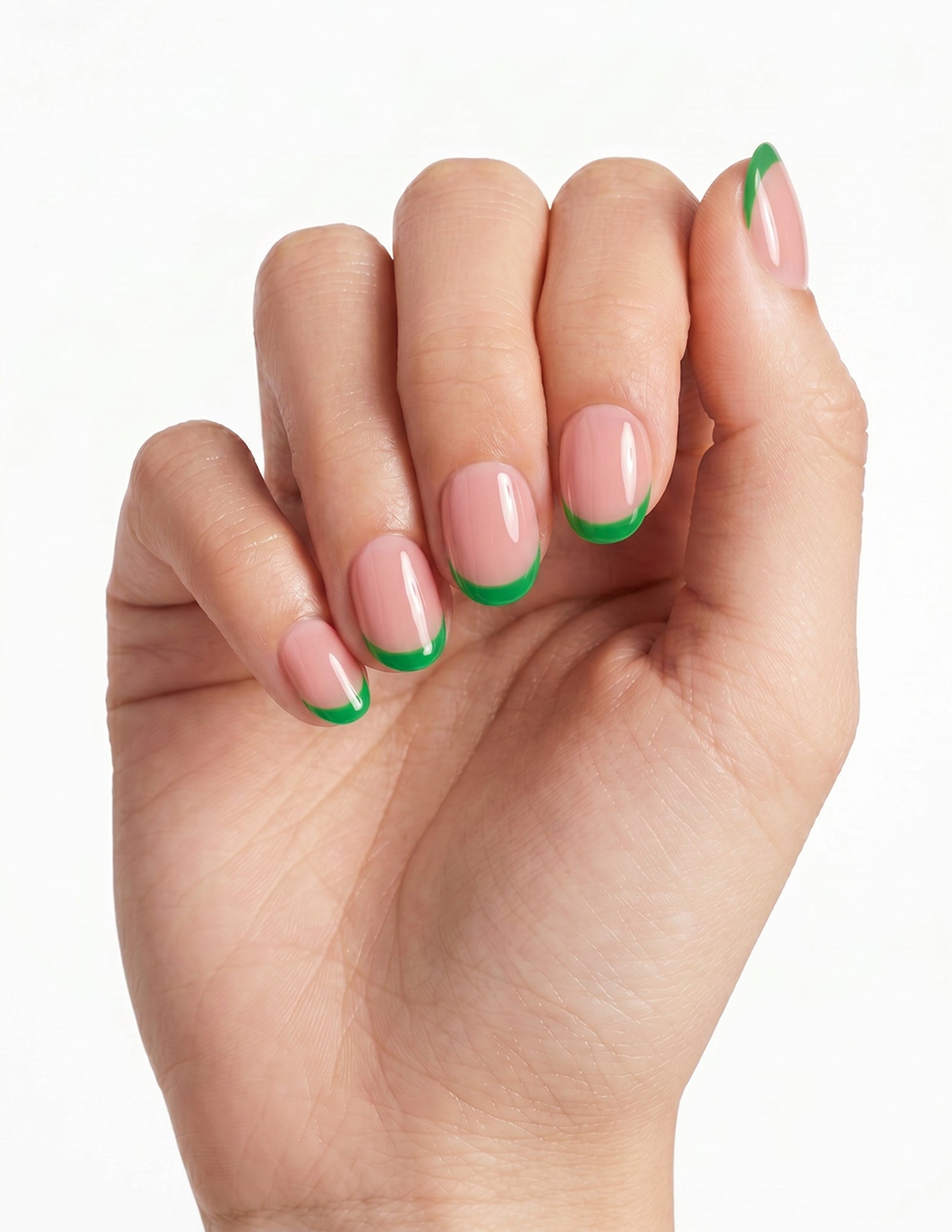 Lime Tips press-on nails — Oval (extra-short), light-skin hand, fingers curled
