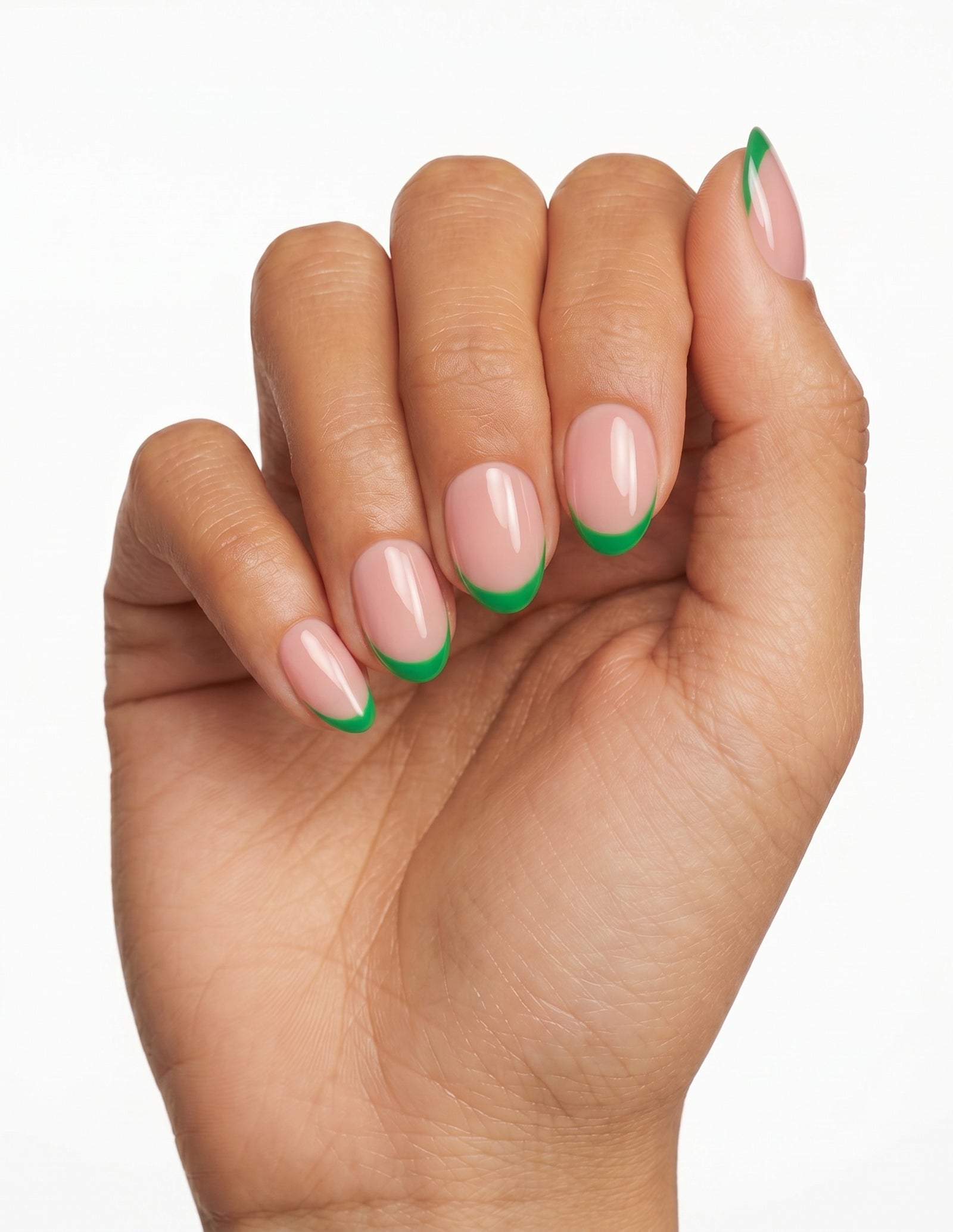 Lime Tips press-on nails — Oval (extra-short), tan hand, fingers curled