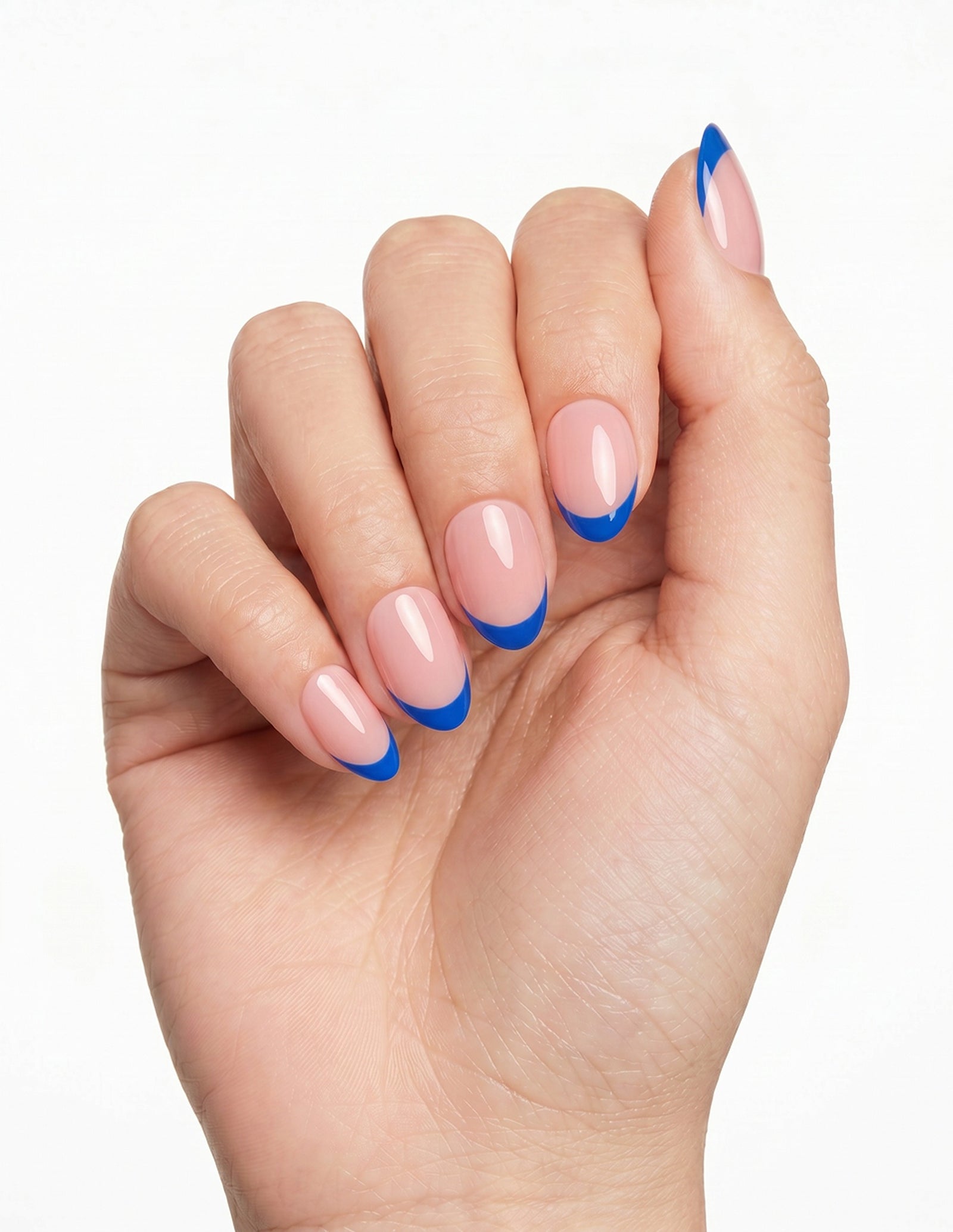 Cobalt Tips press-on nails — Almond (extra-short), light-skin hand, fingers curled