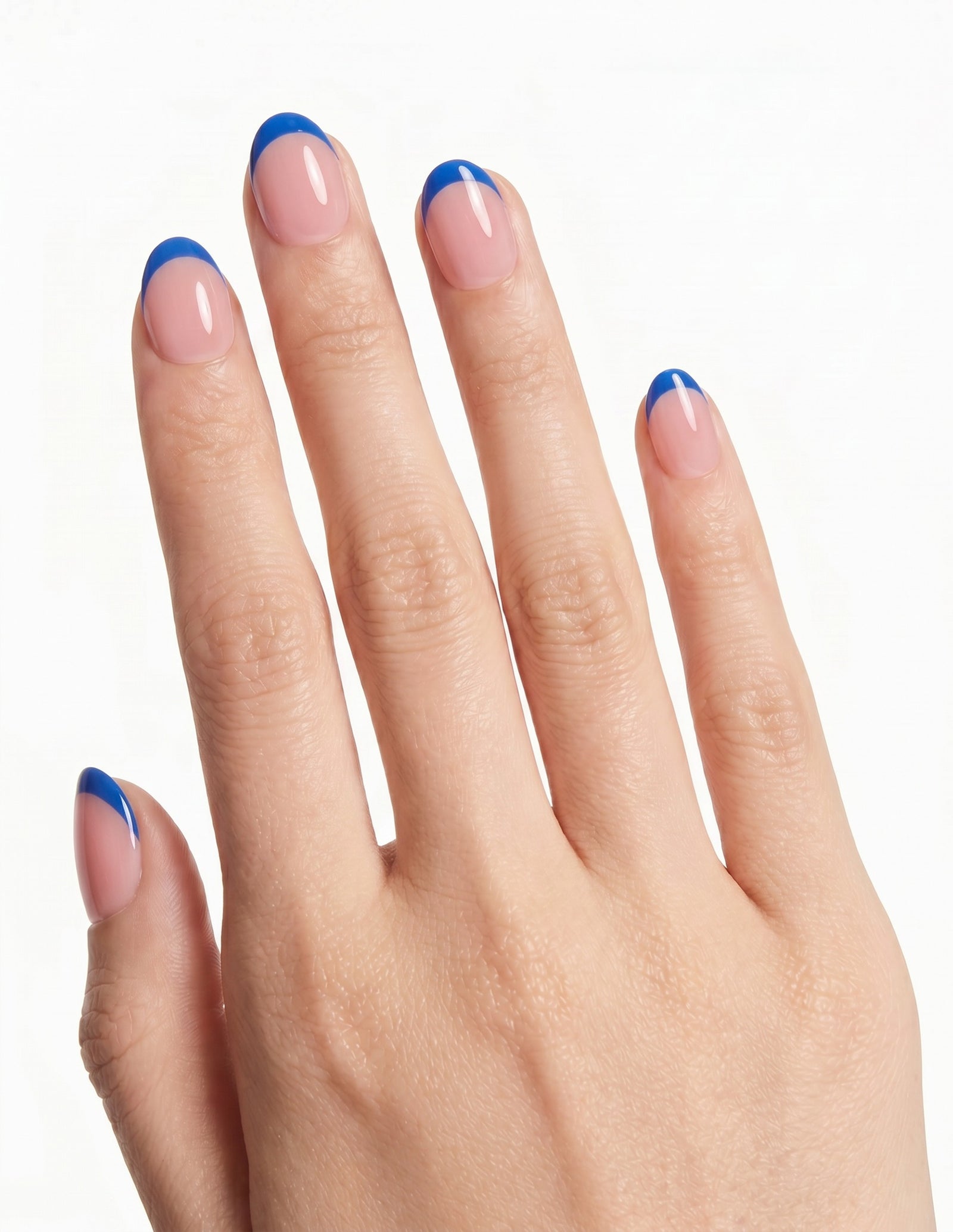 Cobalt Tips press-on nails — Oval (extra-short), light-skin hand, back of hand