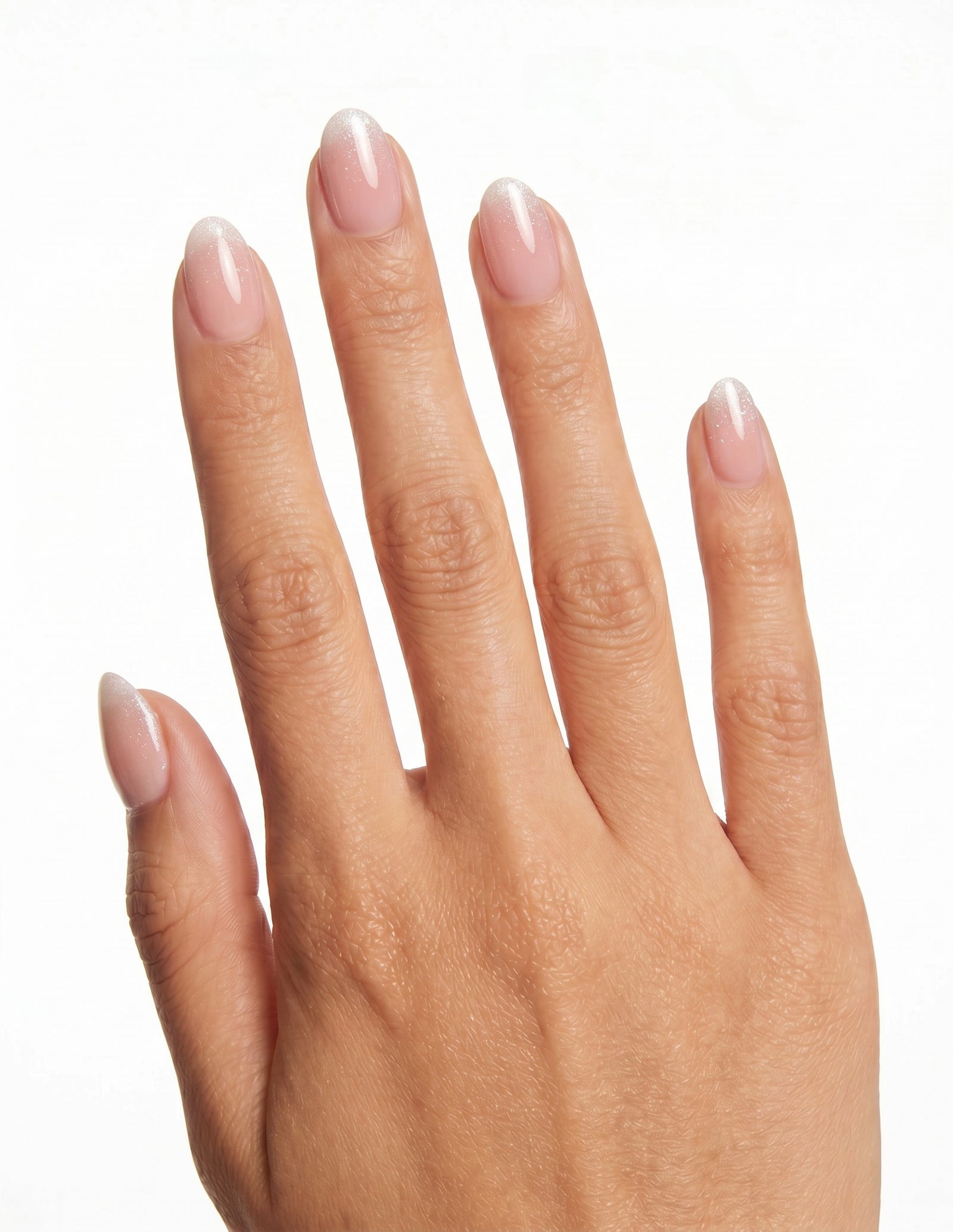 Prosecco press-on nails — Almond (extra-short), tan hand, back of hand