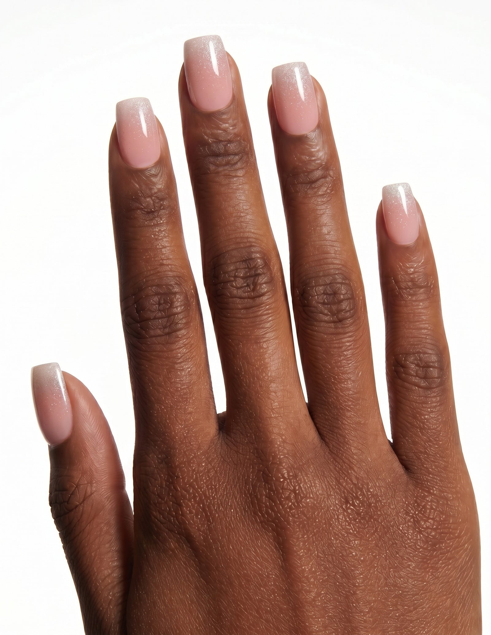 Prosecco press-on nails — Coffin (short), deep-skin hand, back of hand