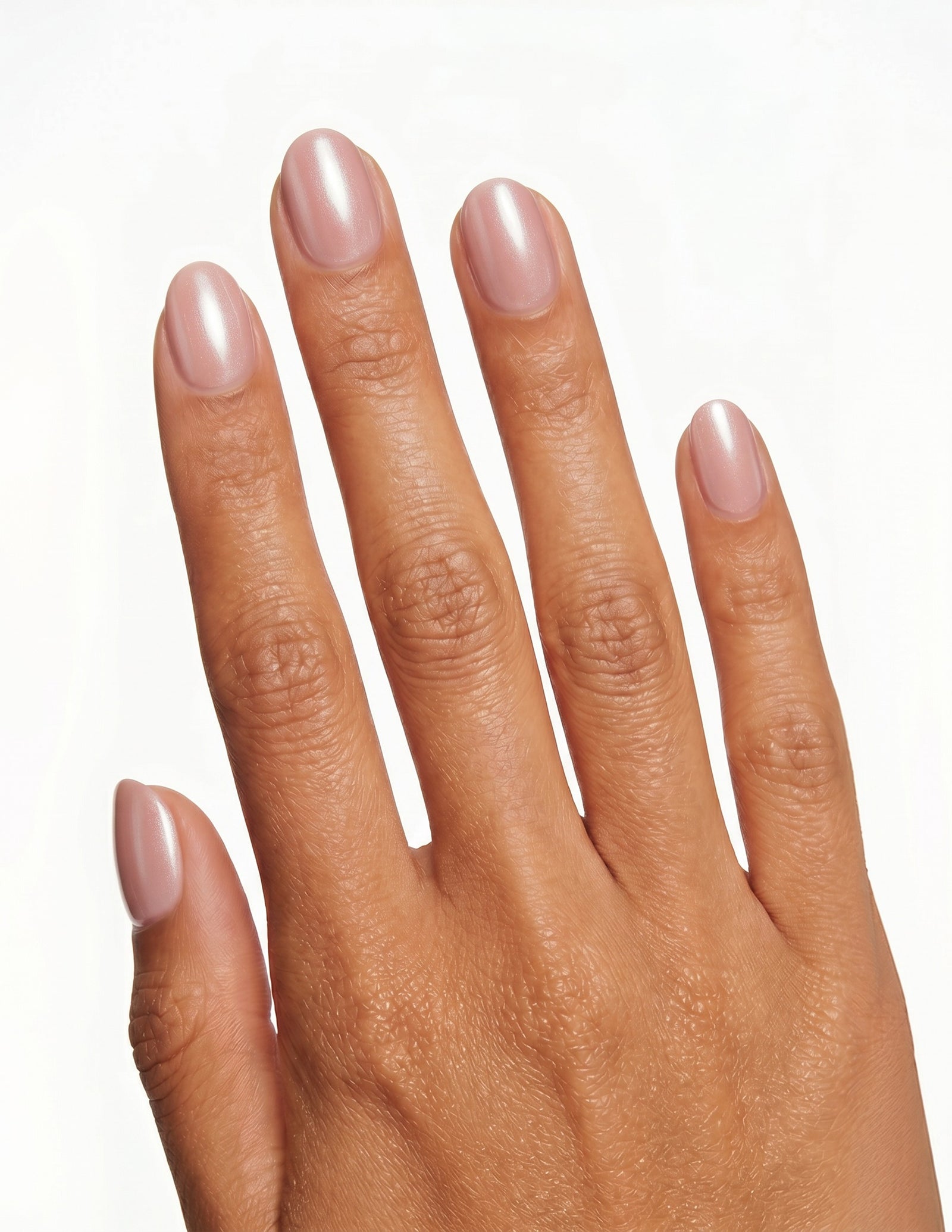 Bare Minimum press-on nails — Oval (extra-short), tan hand, back of hand