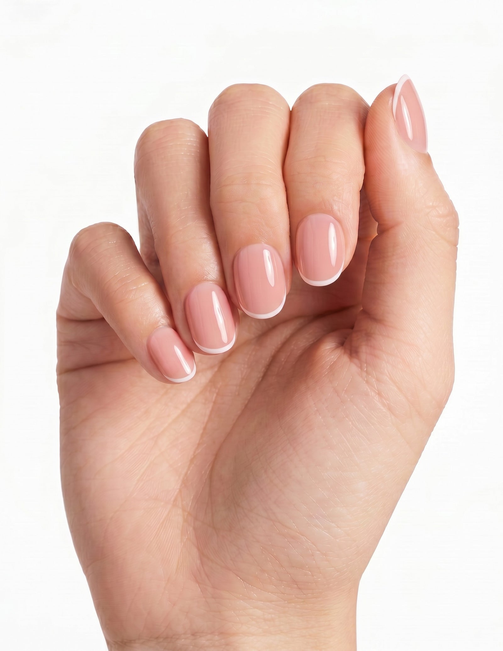 Micro French press-on nails — Oval (extra-short), deep-skin hand, back of hand