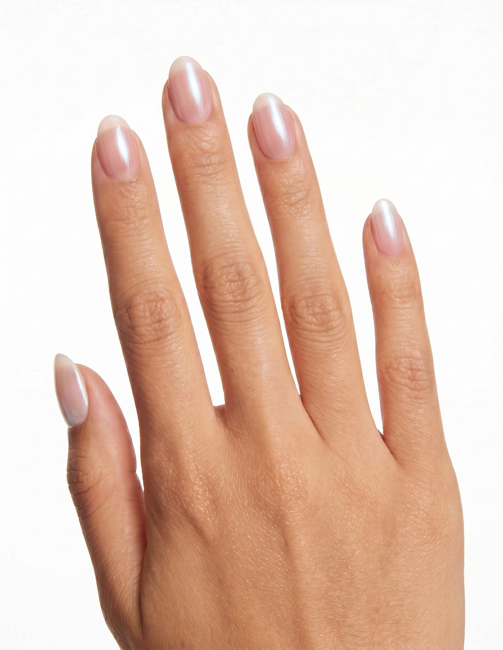 Pearl Slip press-on nails — Almond (extra-short), tan hand, back of hand