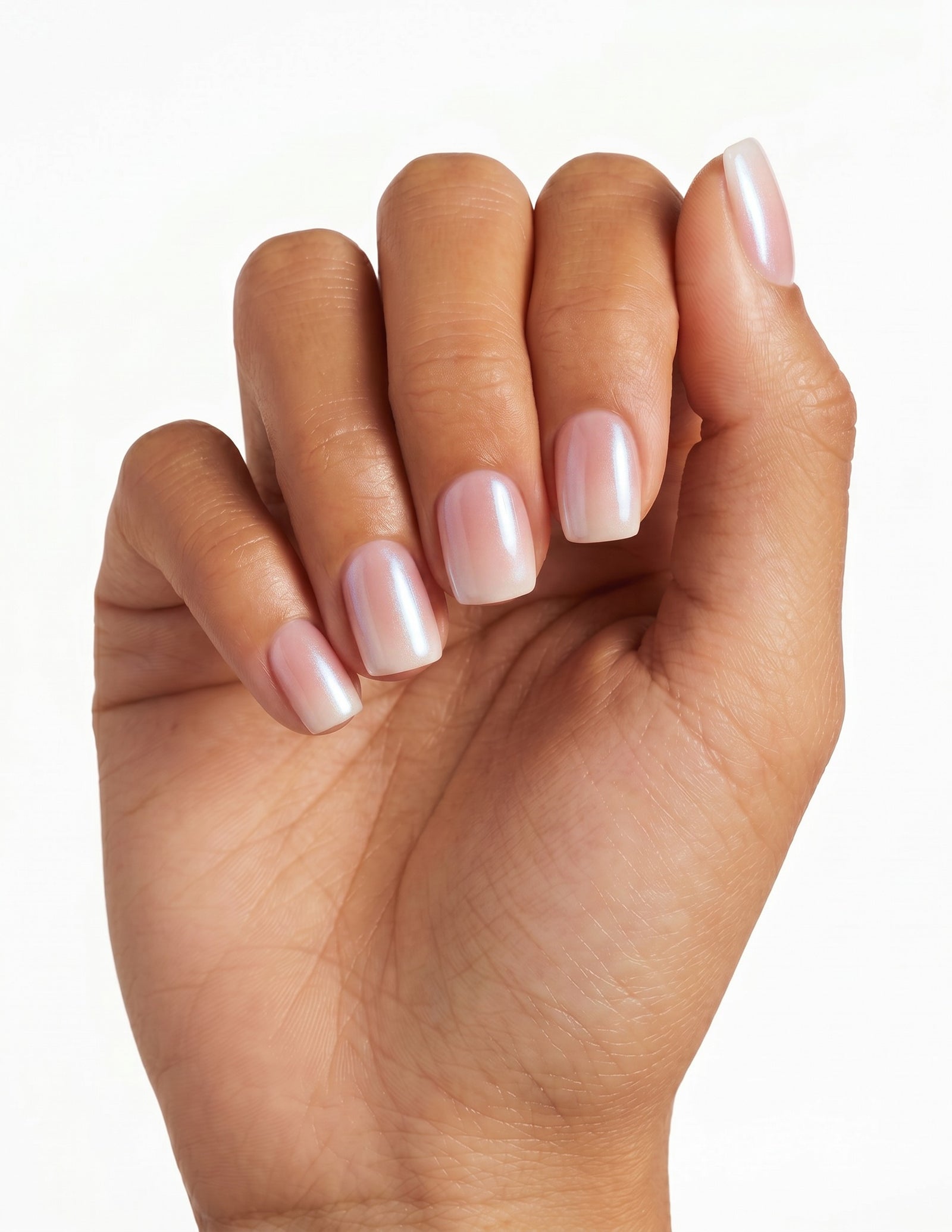 Pearl Slip press-on nails — Coffin (short), tan hand, fingers curled