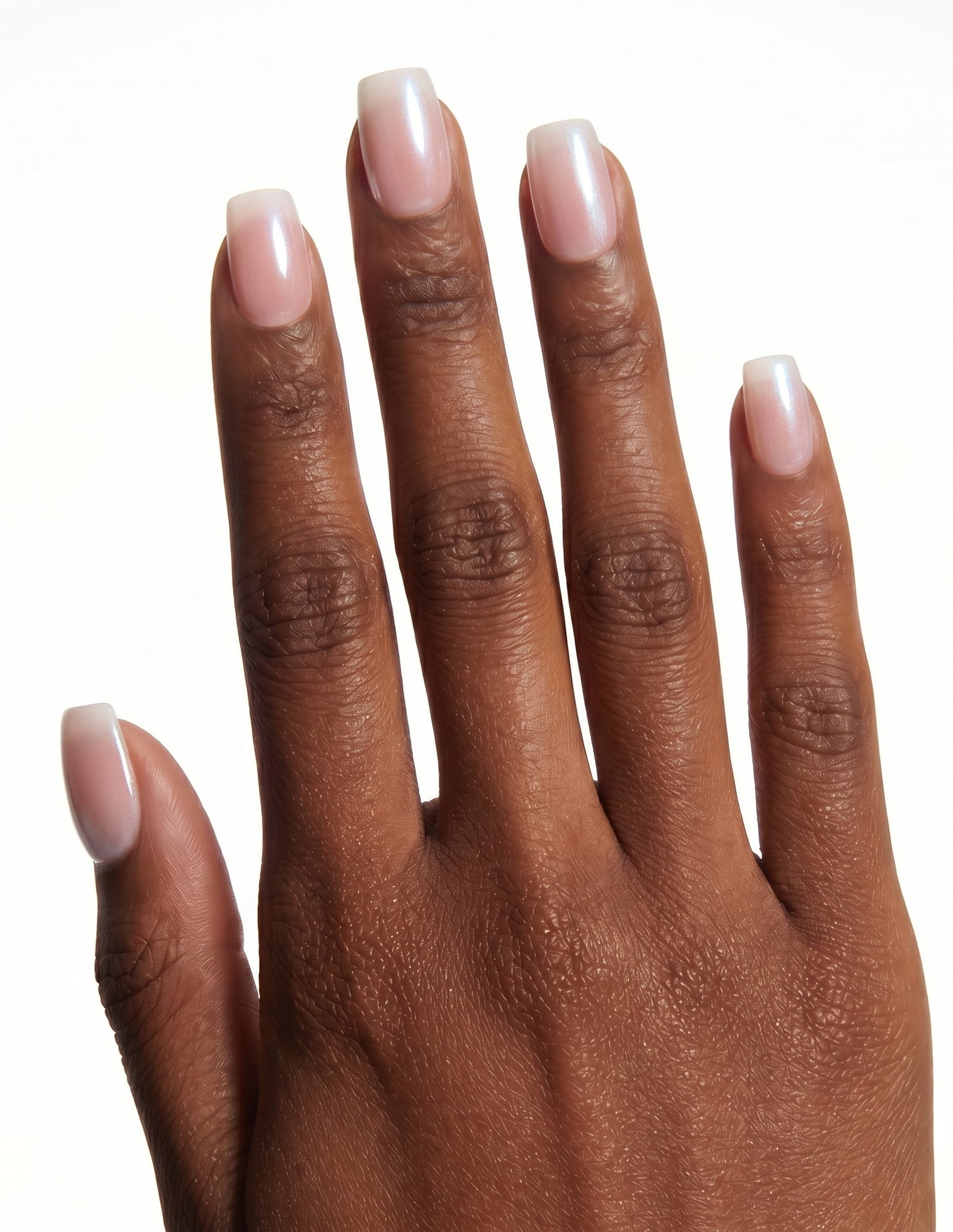 Pearl Slip press-on nails — Coffin (short), deep-skin hand, back of hand