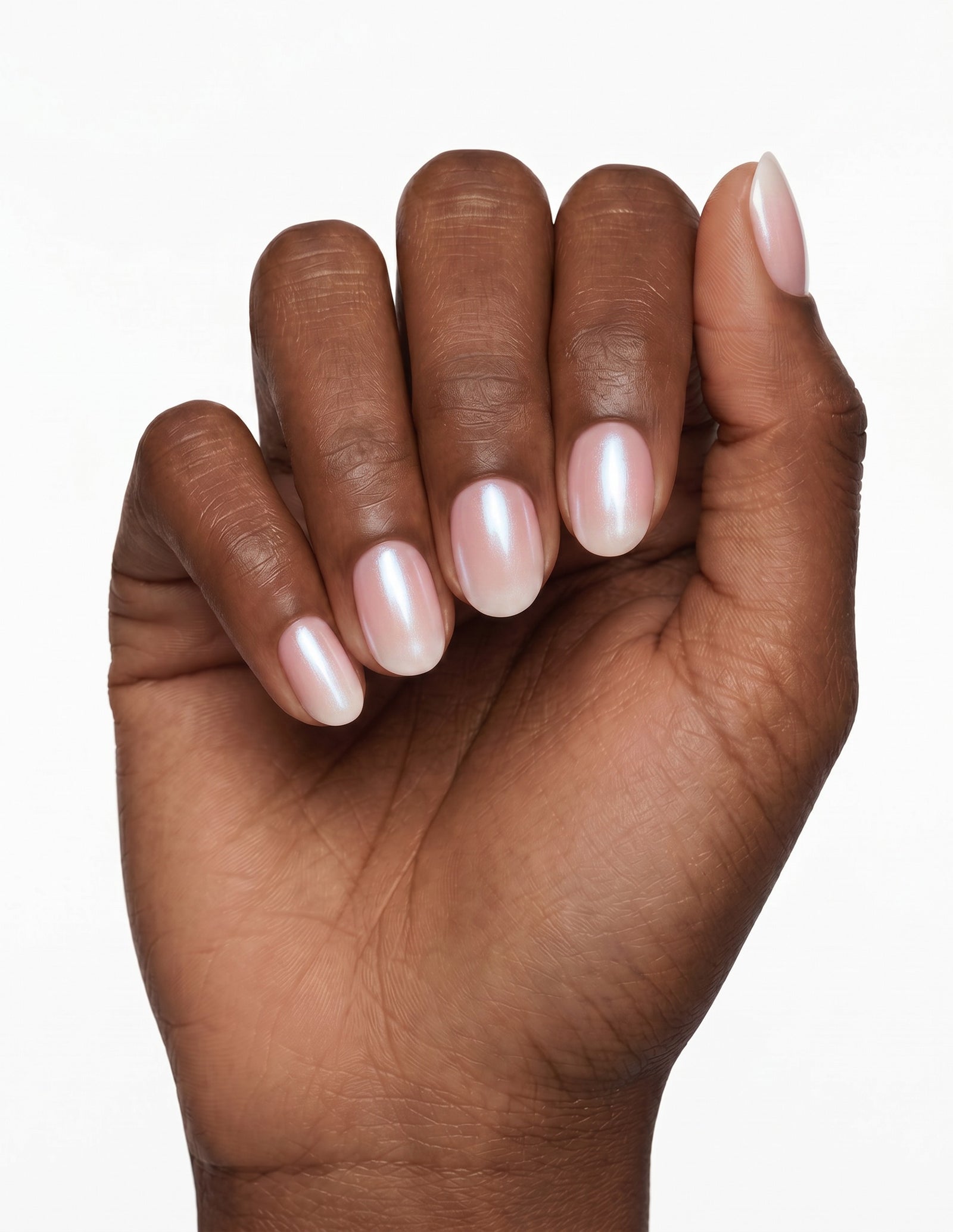 Pearl Slip press-on nails — Oval (extra-short), deep-skin hand, fingers curled