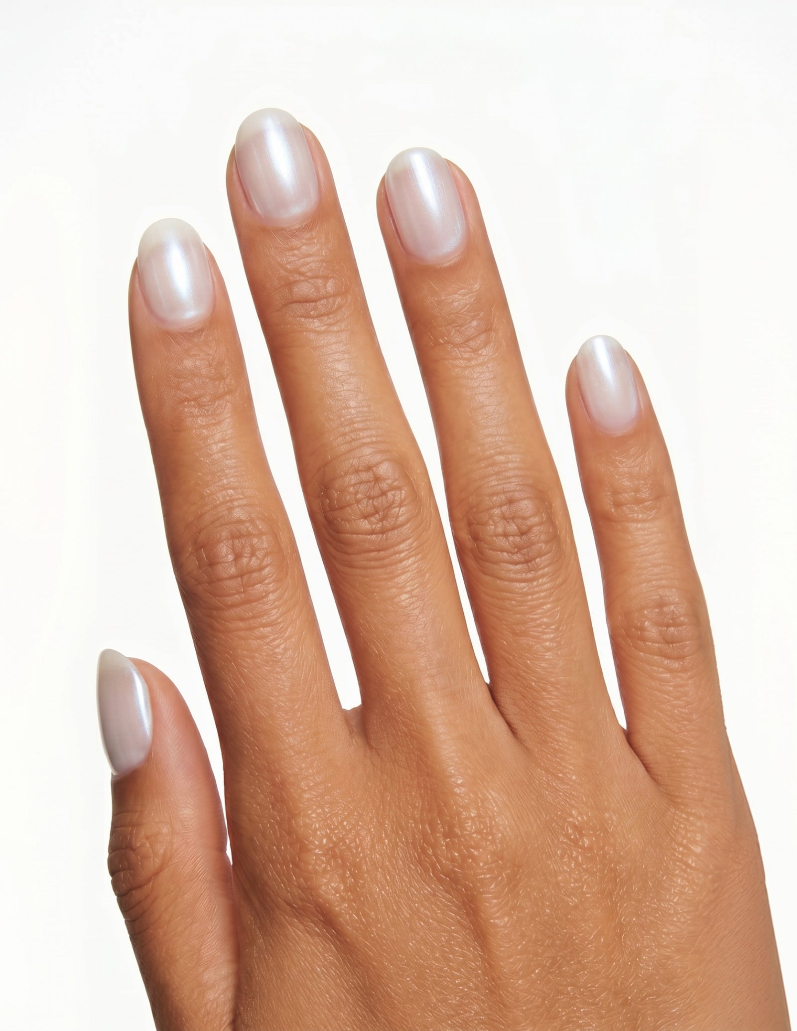 Glazed press-on nails — Oval (extra-short), tan hand, back of hand