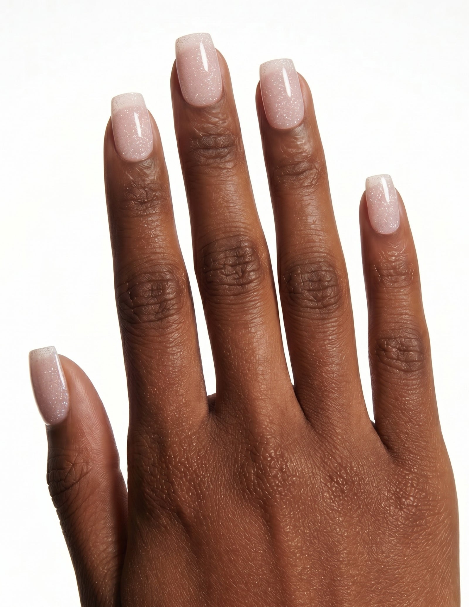Disco Velvet press-on nails — Coffin (short), deep-skin hand, back of hand