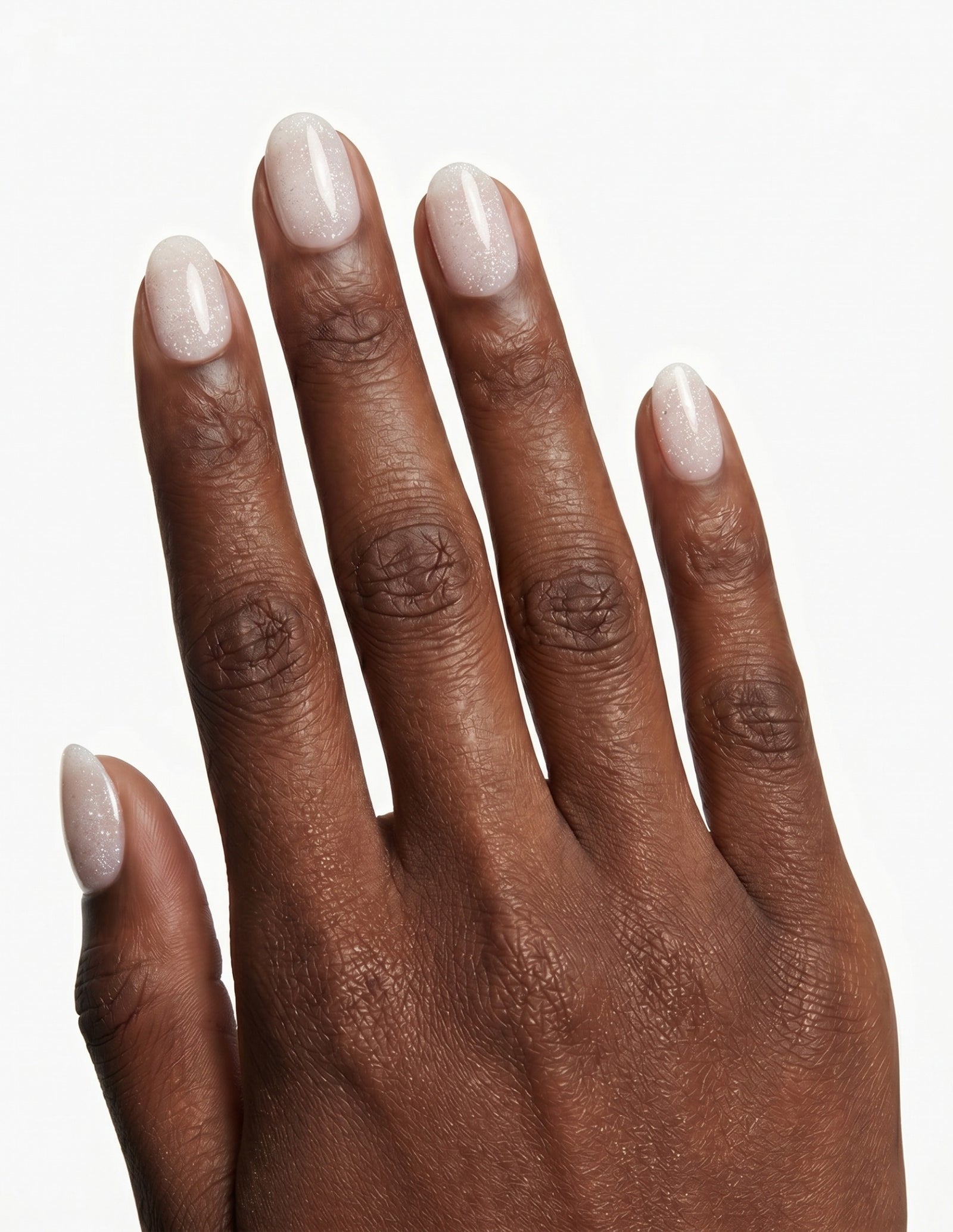 Disco Velvet press-on nails — Oval (extra-short), deep-skin hand, back of hand