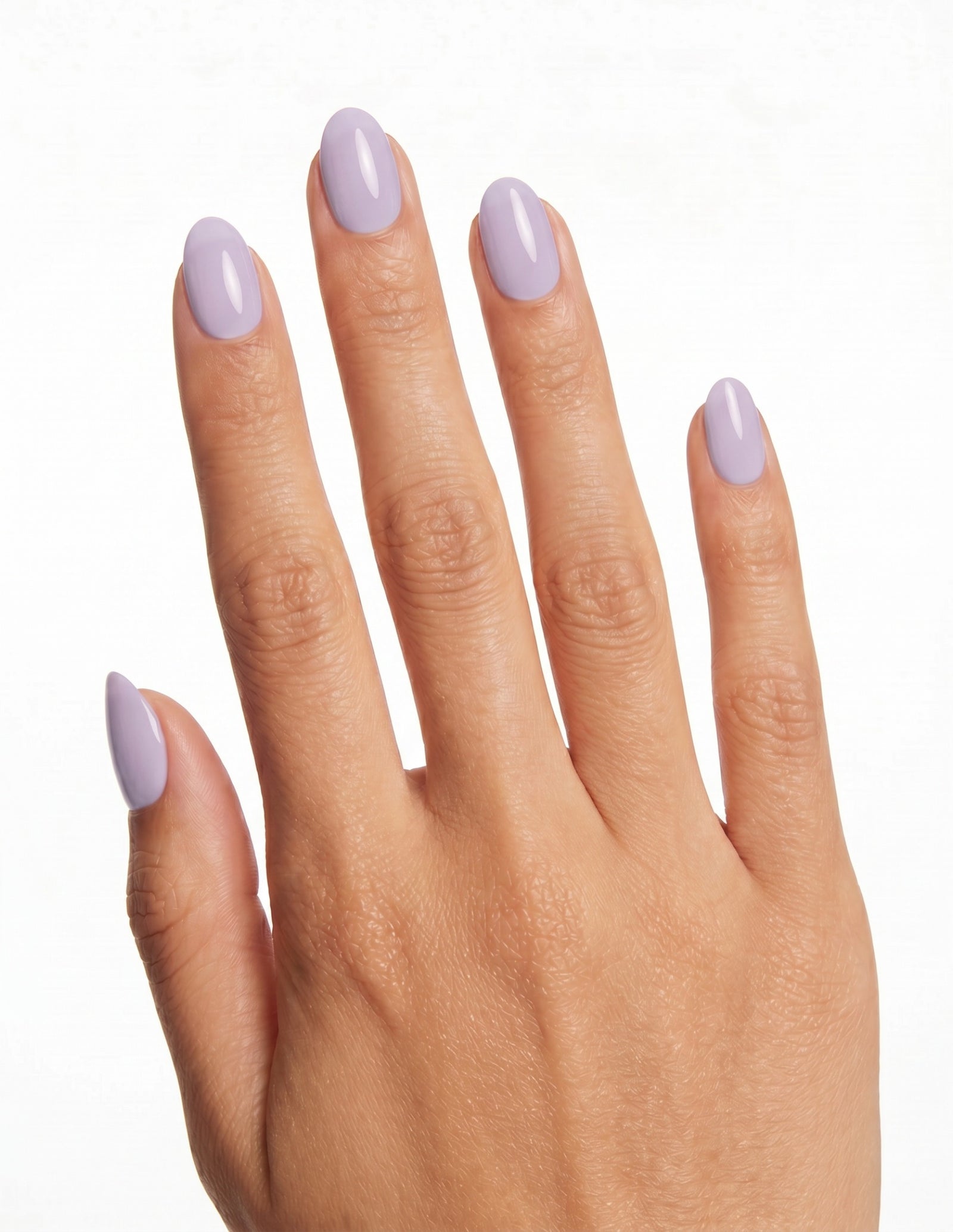 Lilac press-on nails — Almond (extra-short), tan hand, back of hand