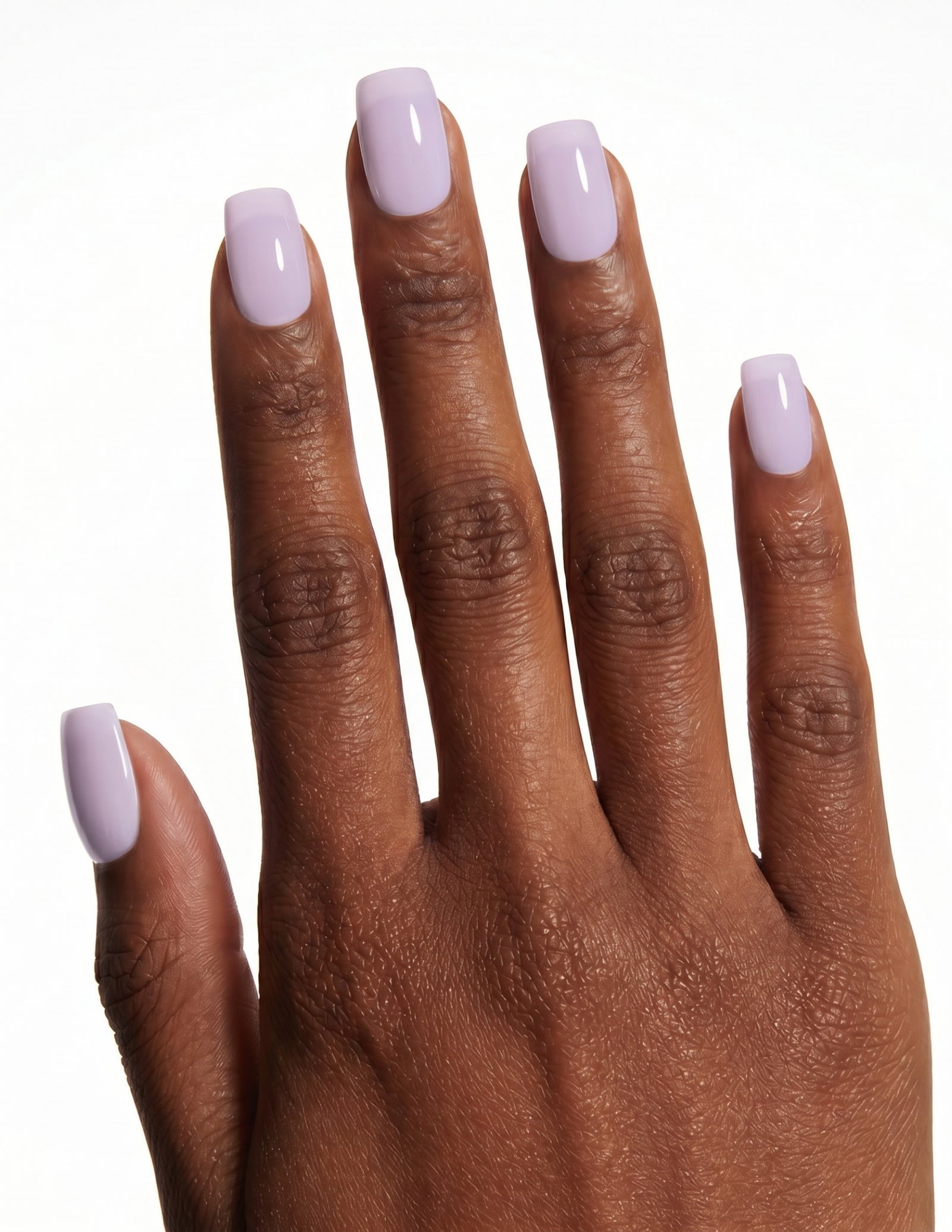 Lilac press-on nails — Coffin (short), deep-skin hand, back of hand