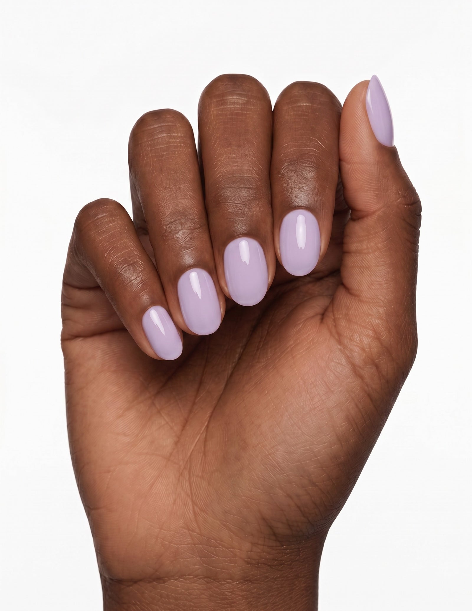 Lilac press-on nails — Oval (extra-short), deep-skin hand, fingers curled