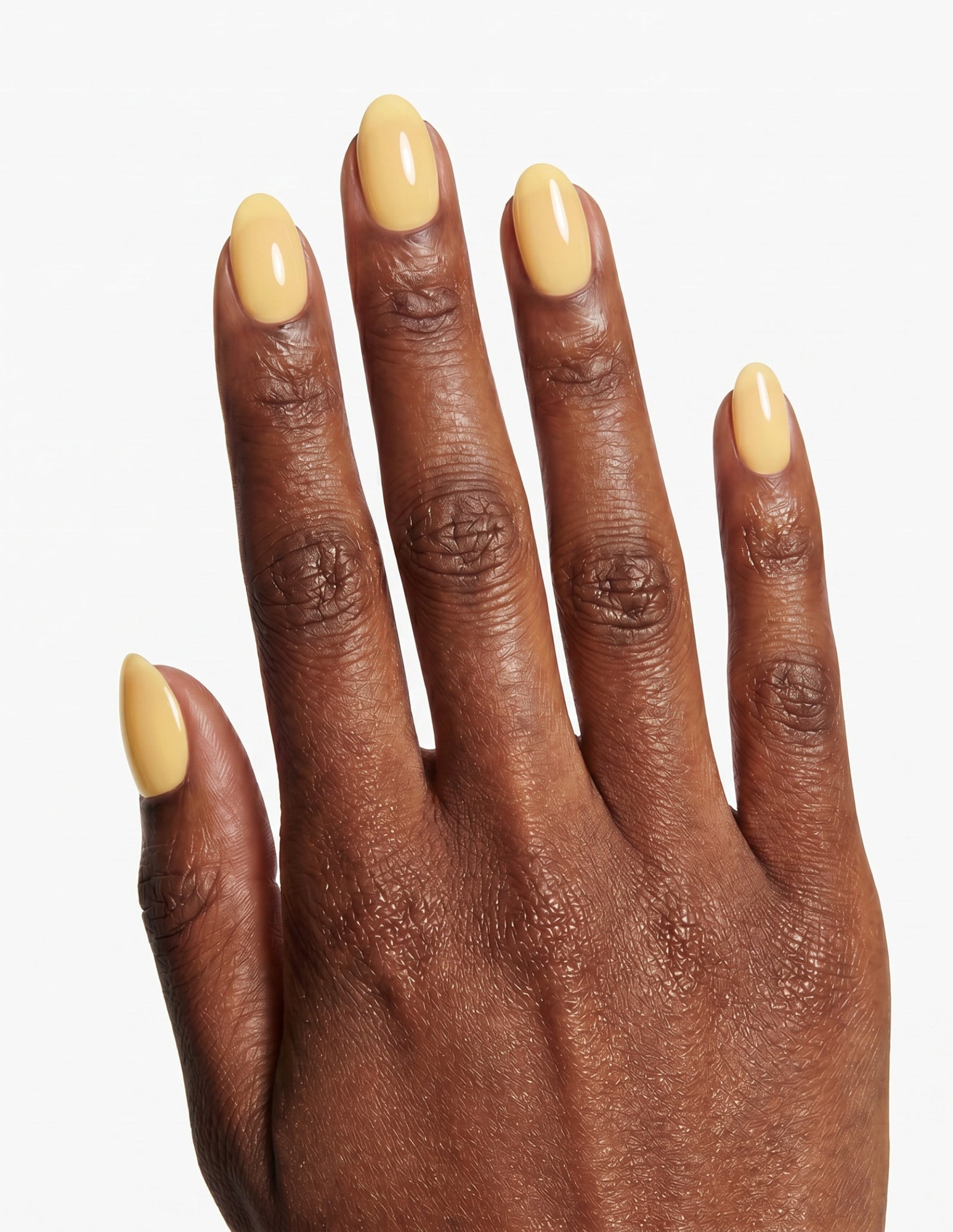 Butter press-on nails — Almond (extra-short), deep-skin hand, back of hand