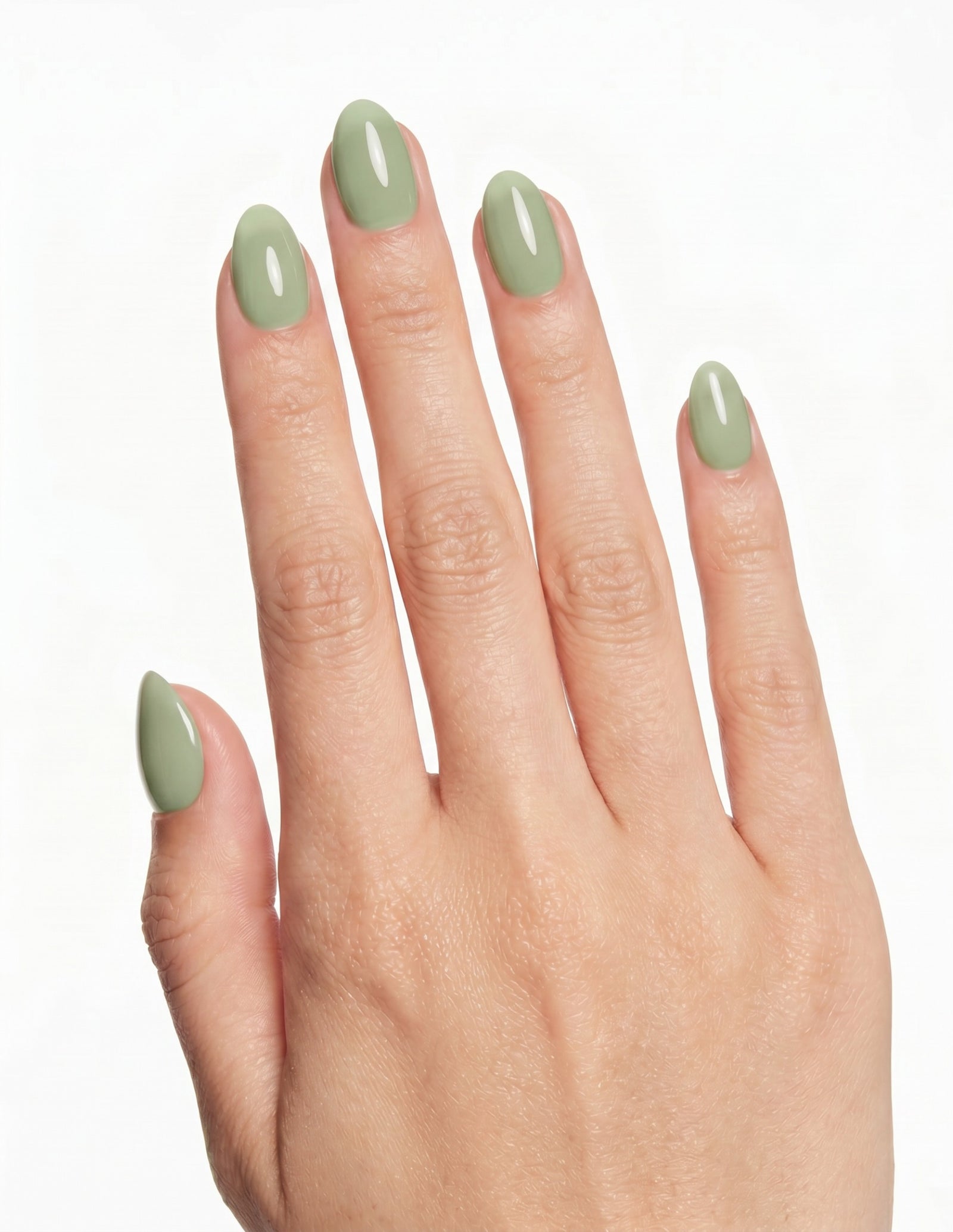 Pistachio press-on nails — Almond (extra-short), light-skin hand, back of hand