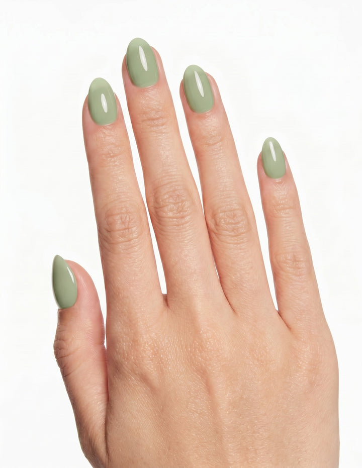 Pistachio press-on nails — Almond (extra-short), light-skin hand, back of hand