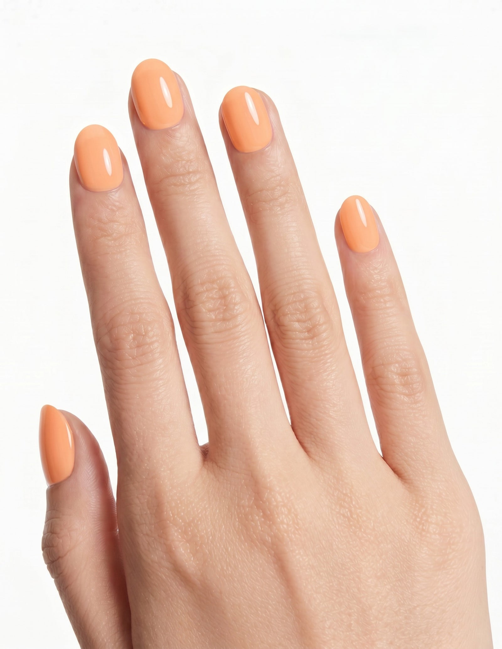 Apricot press-on nails — Oval (extra-short), light-skin hand, back of hand