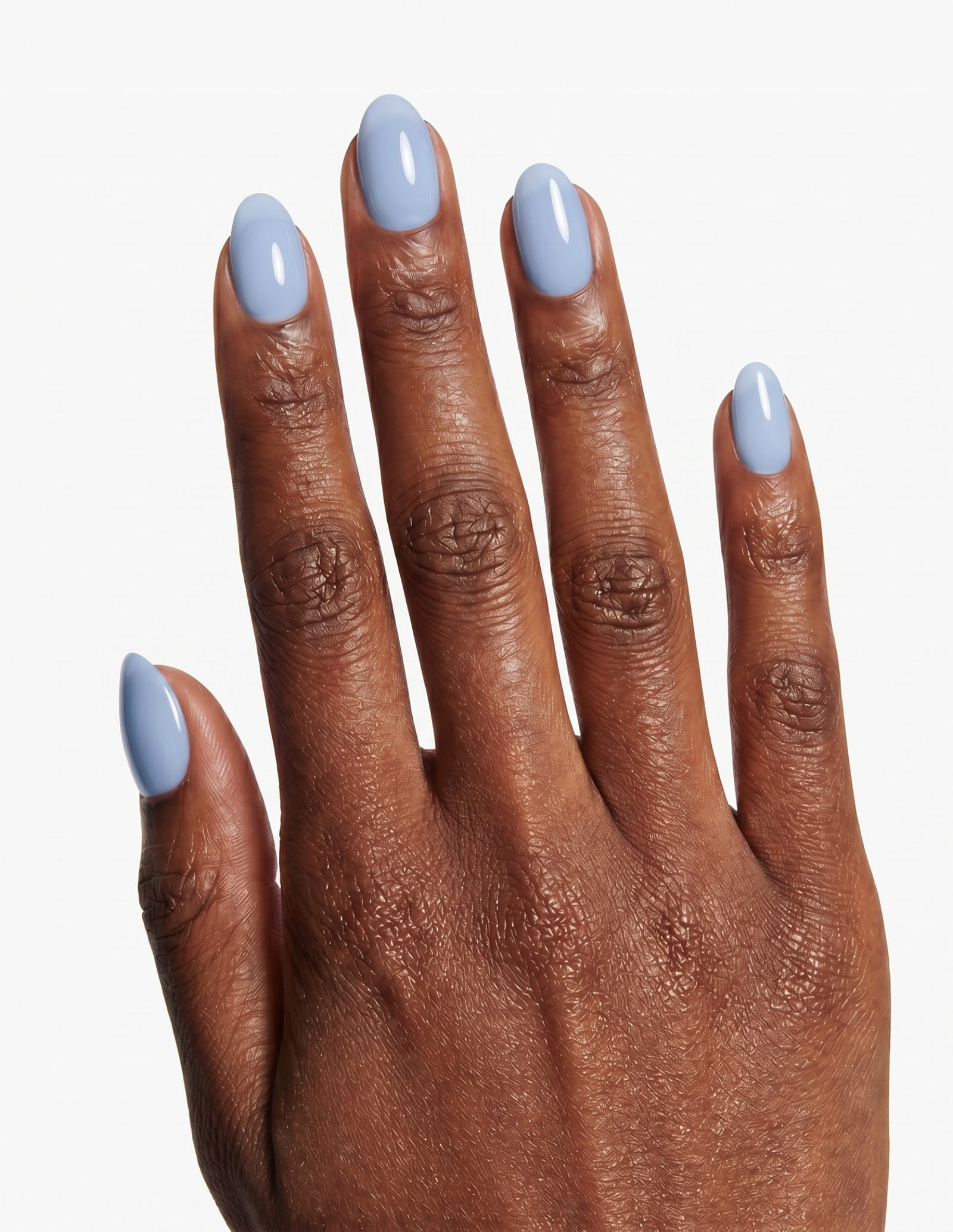 Baby Blue press-on nails — Almond (extra-short), deep-skin hand, back of hand