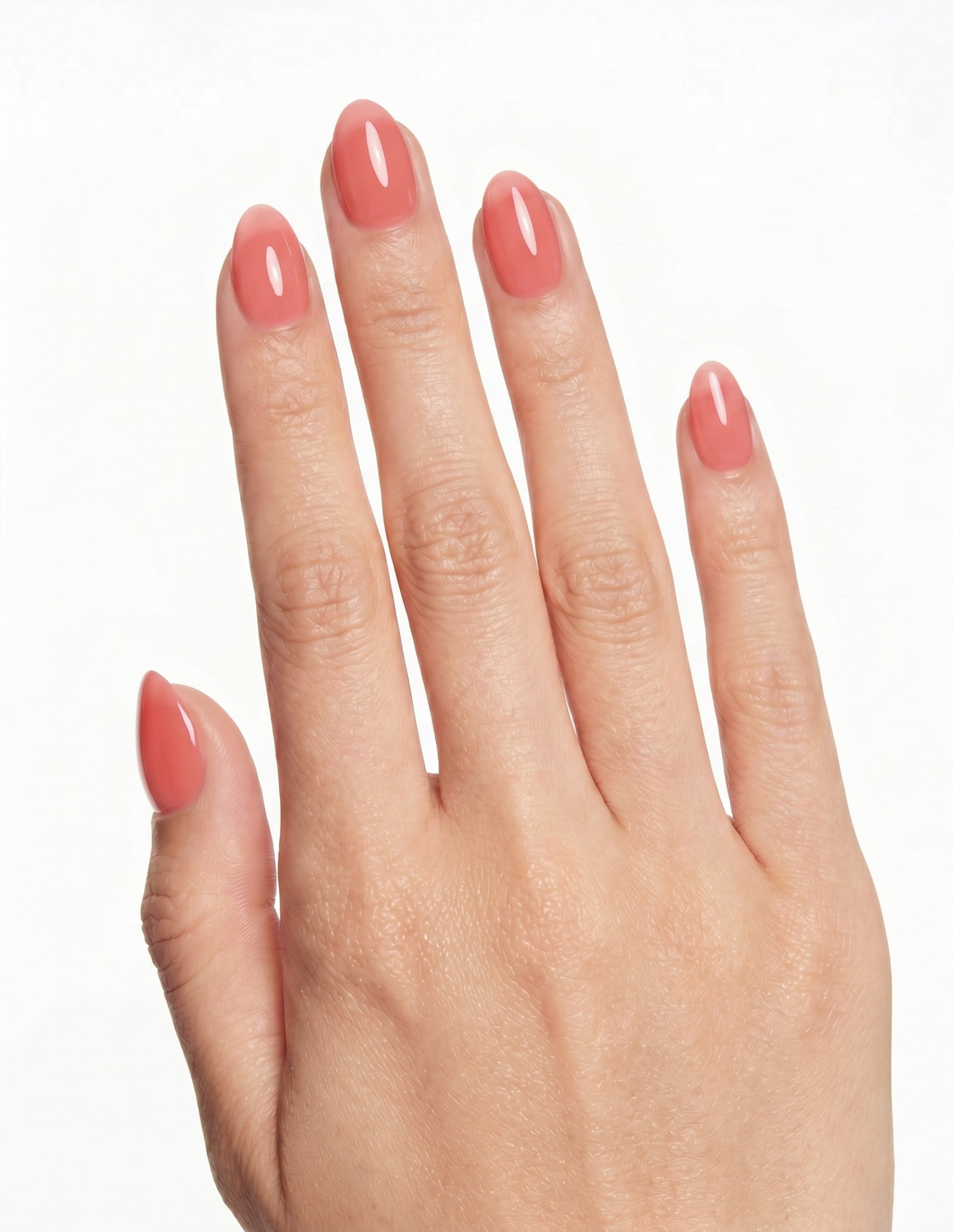Guava press-on nails — Almond (extra-short), light-skin hand, back of hand