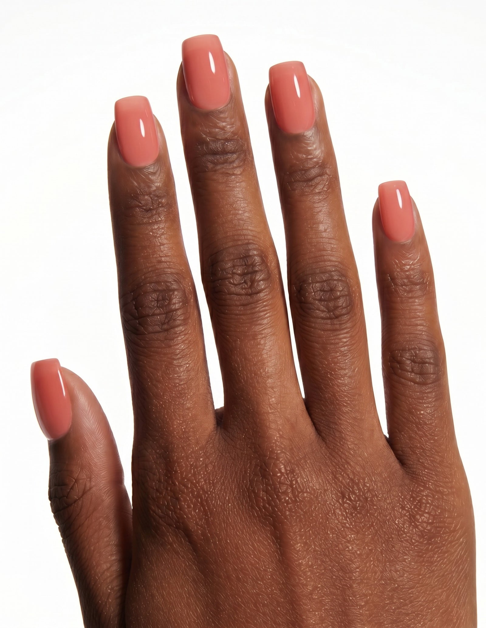 Guava press-on nails — Coffin (short), deep-skin hand, back of hand