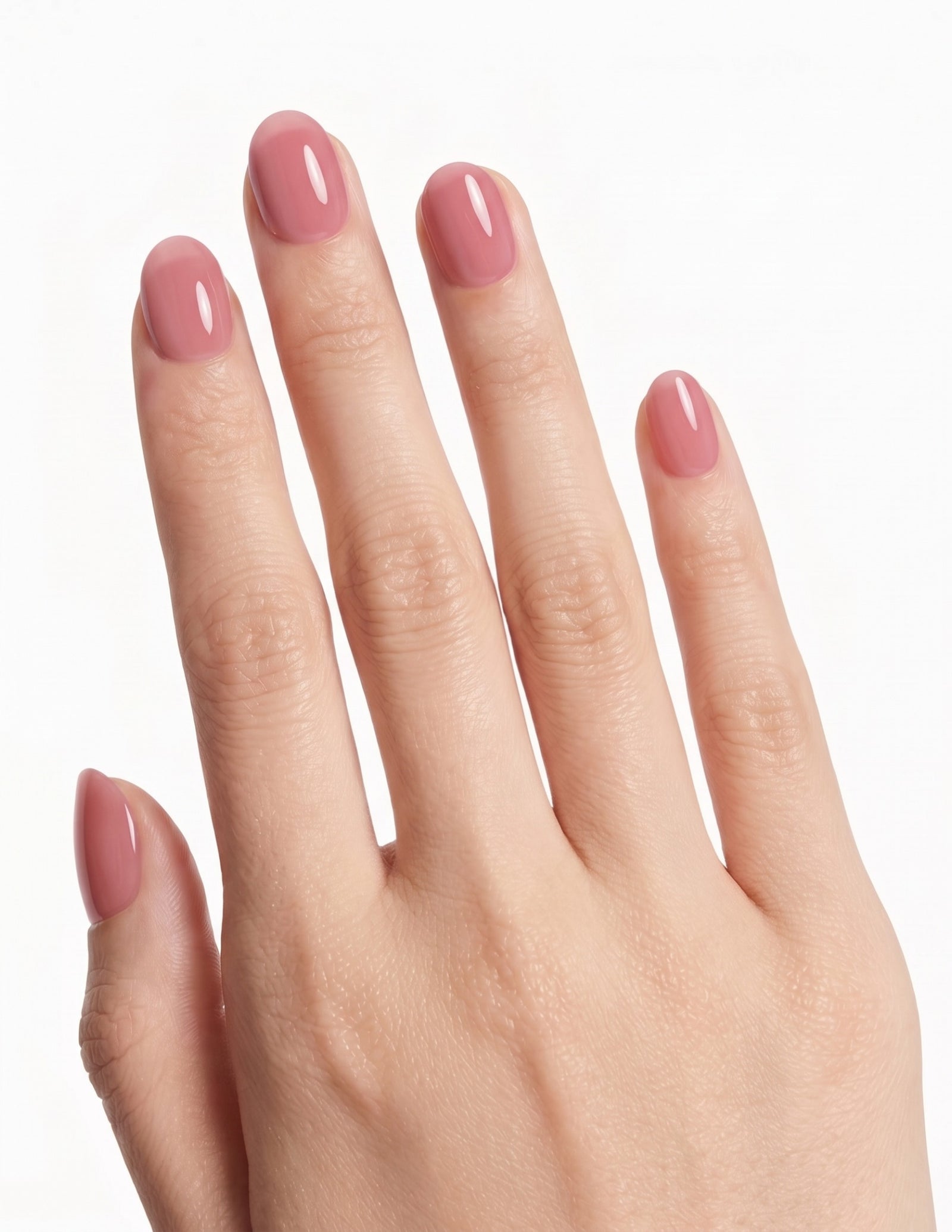 Rose Milk press-on nails — Oval (extra-short), tan hand, back of hand