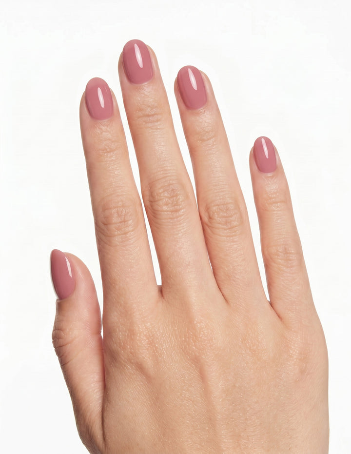Dusty Rose press-on nails — Almond (extra-short), light-skin hand, back of hand