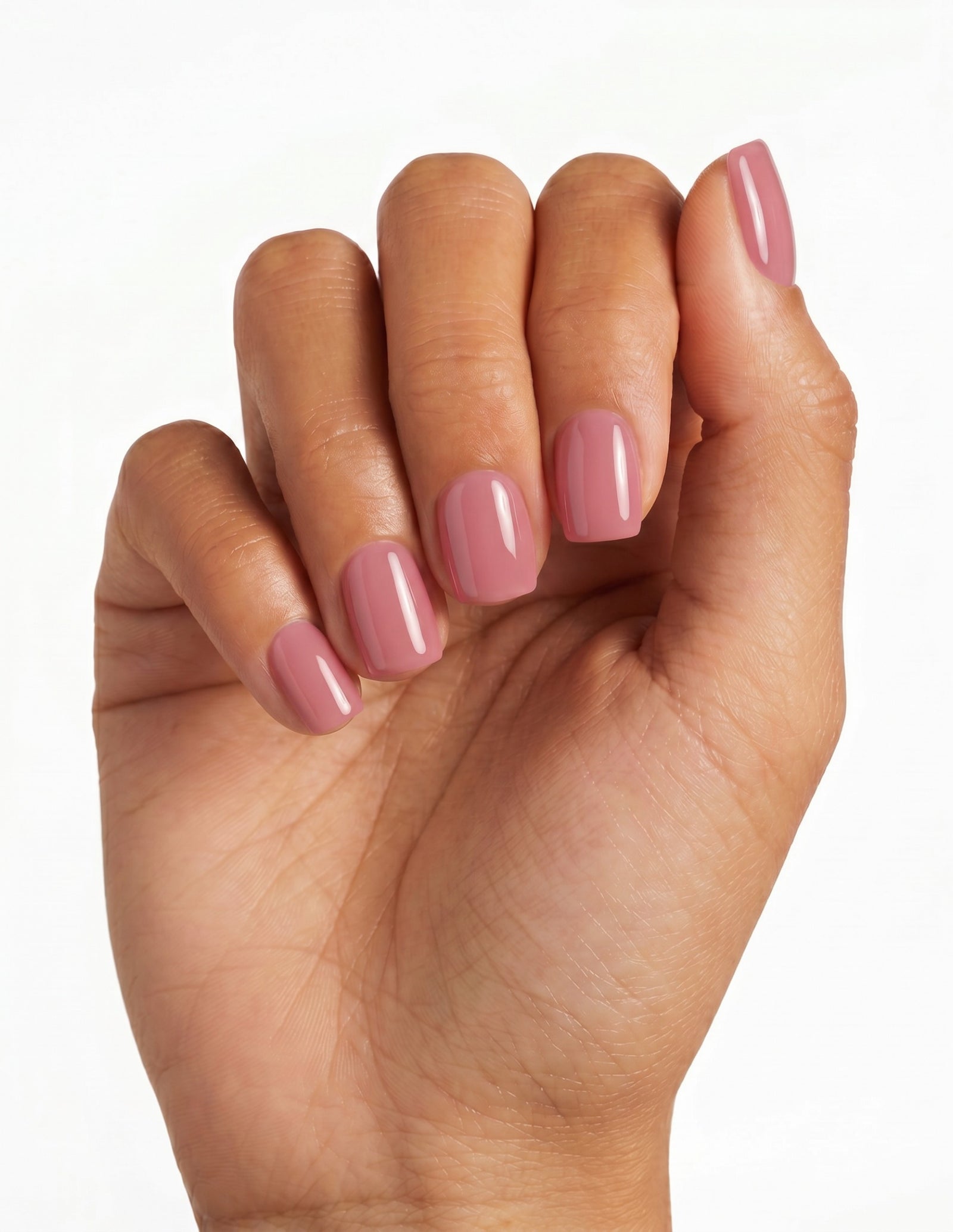 Dusty Rose press-on nails — Coffin (short), tan hand, fingers curled